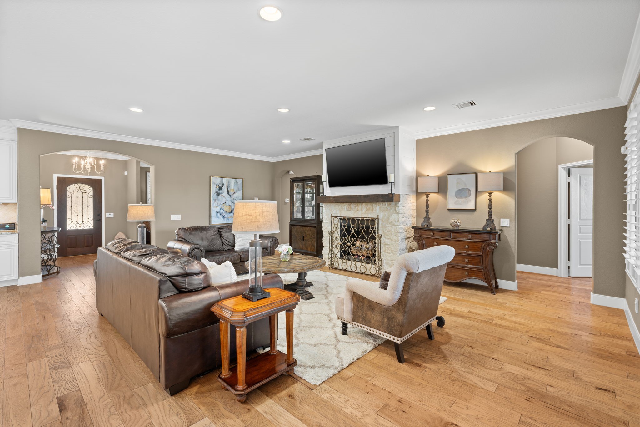 The wood flooring throughout is beautifully crafted and adds a touch of elegance.