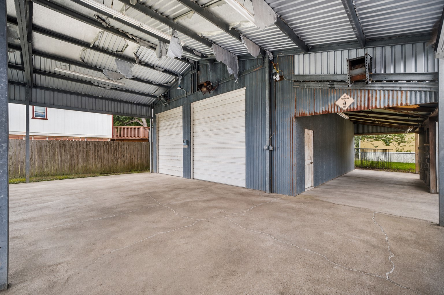 There's a 26x40 carport with metal roof and 10x30 lean-to with fish cleaning table and utility There's a 26x40 carport with metal roof and 10x30 lean-to with fish cleaning table and utility