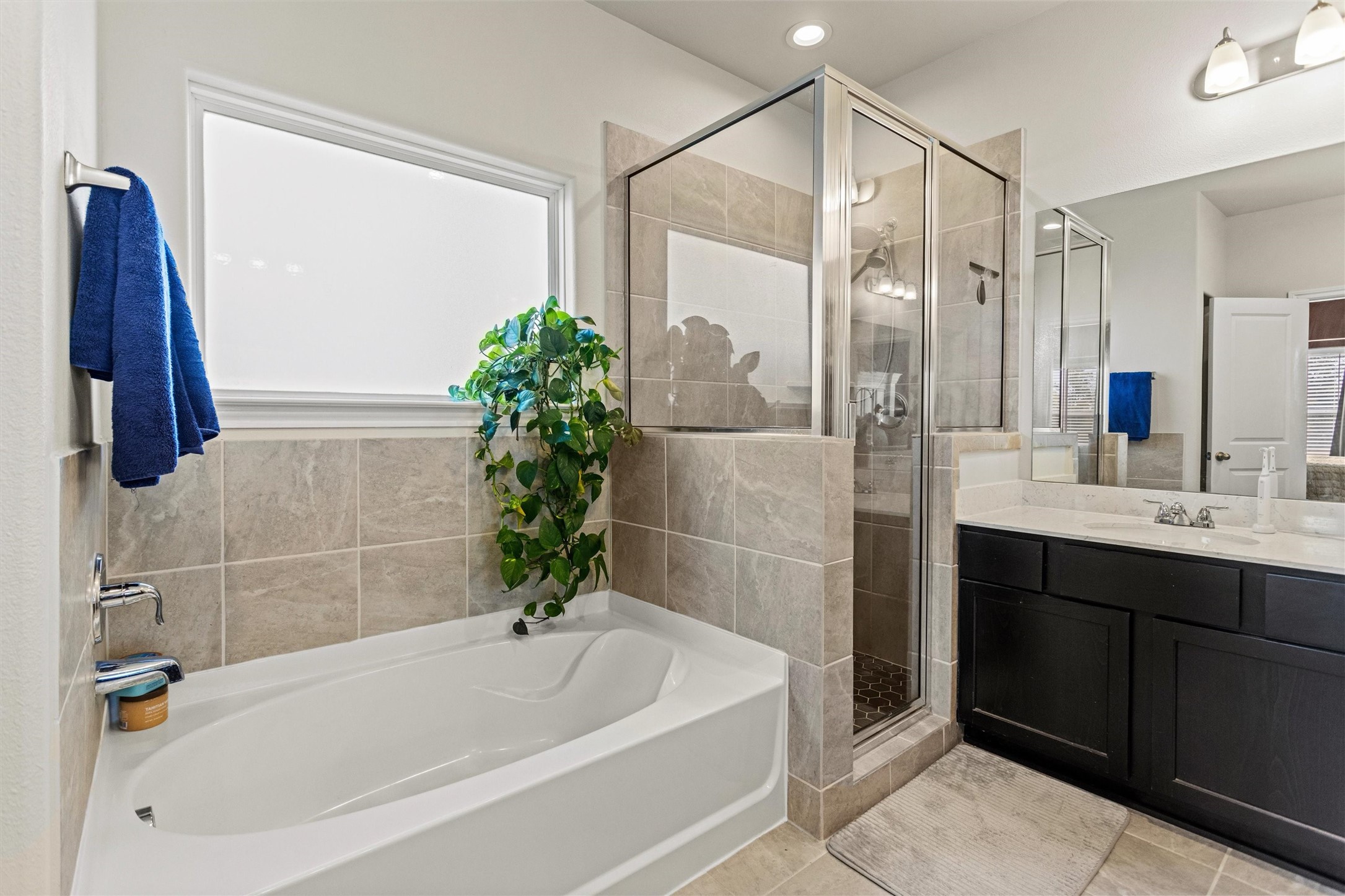 Features a separate shower and soaking tub.
