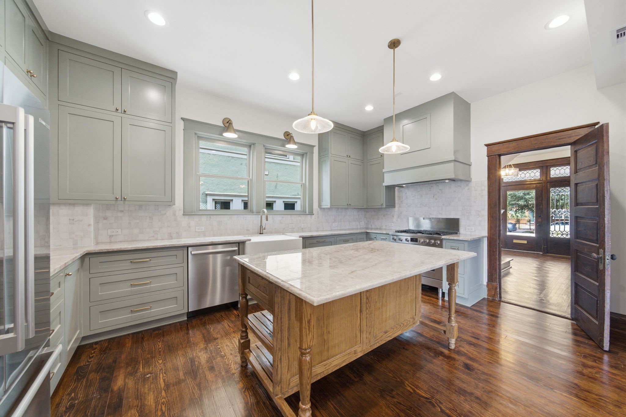 Another view of the kitchen, highlighting the great space and upgraded in-lay cabinetry. Lighting fixtures all from Pottery Barn or West Elm