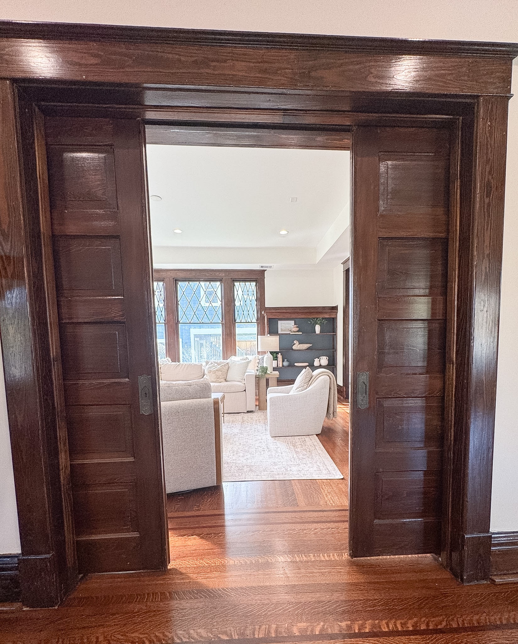 Beautiful original double doors separating the dining and living spaces.