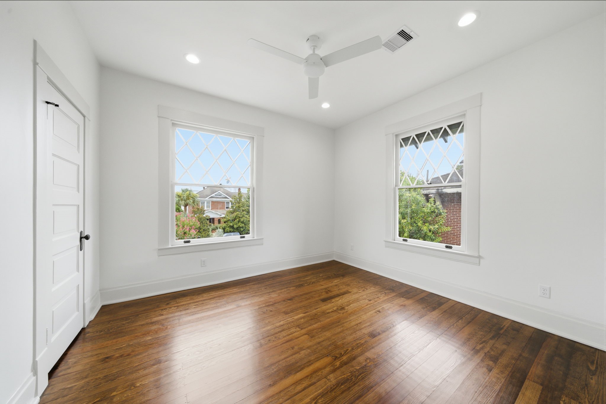 One of the Jack and Jill rooms upstairs. Original pine floors and wonderful natural light and views of the neighborhood.