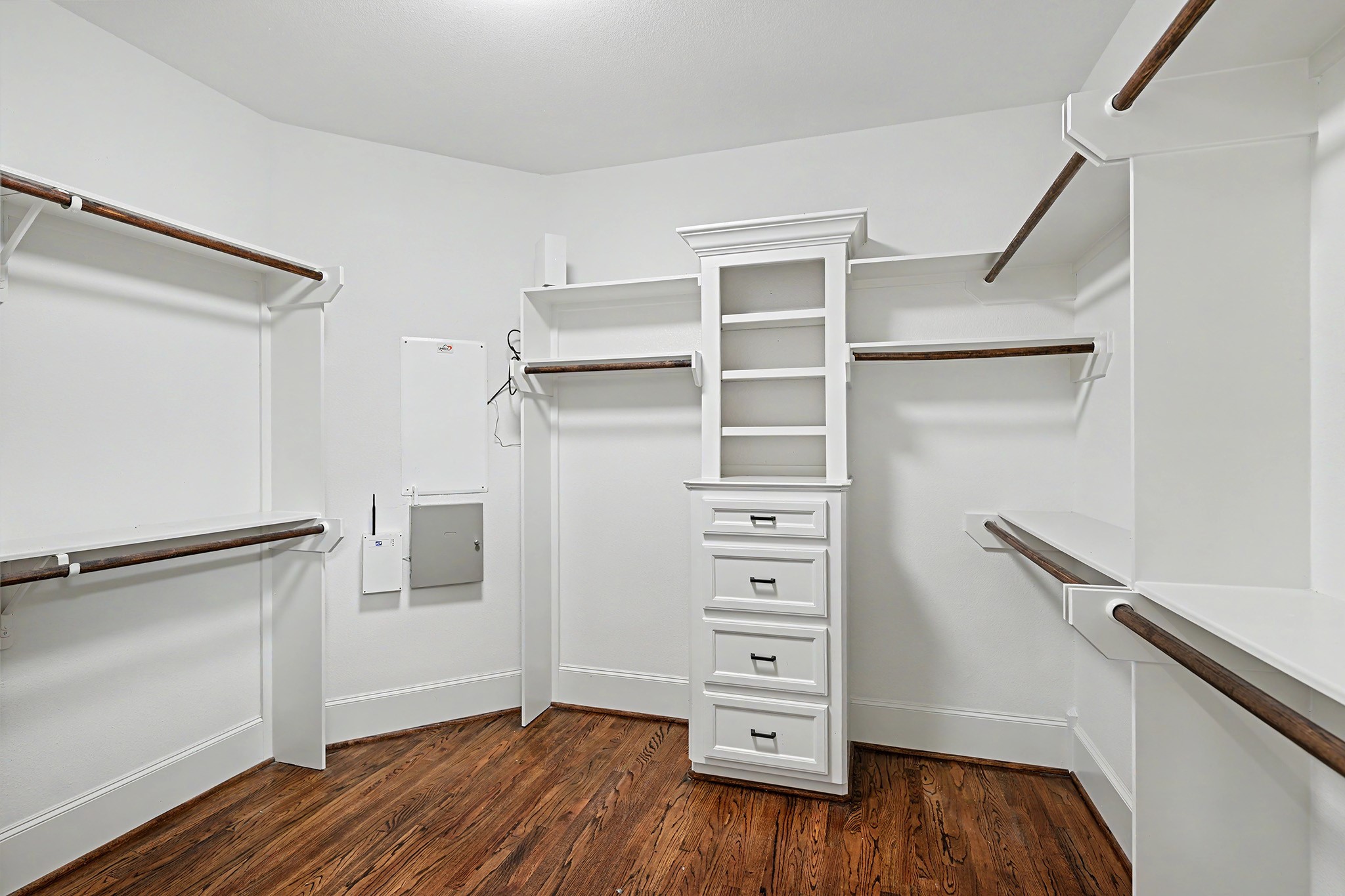 One of two walk-in closets for the primary bedroom.