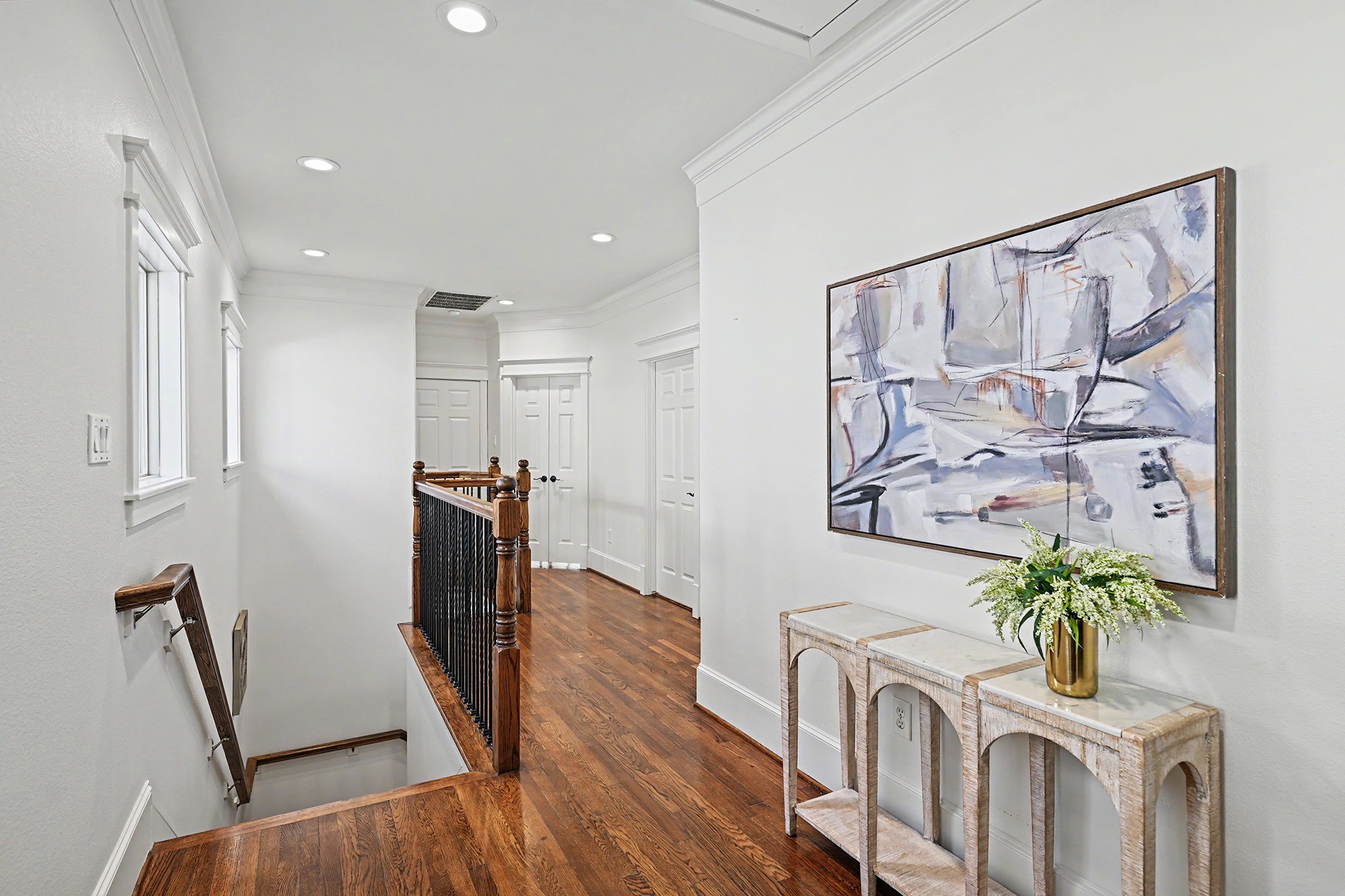 Upstairs landing area from the staircase is open and airy.