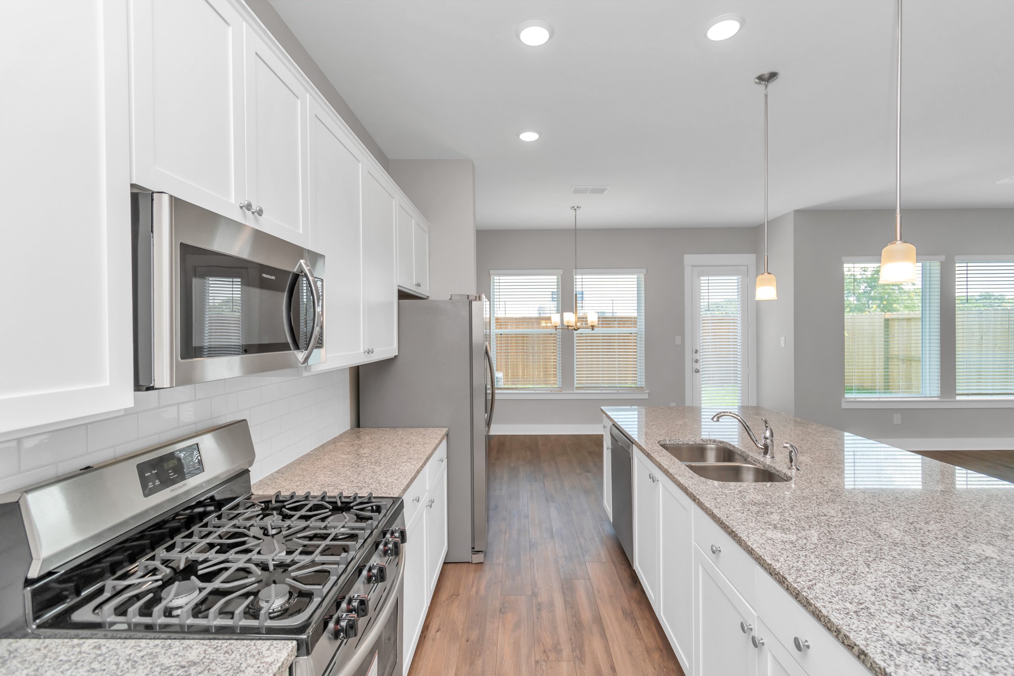 Elegant Granite Countertops & Stainless Steel Appliances.