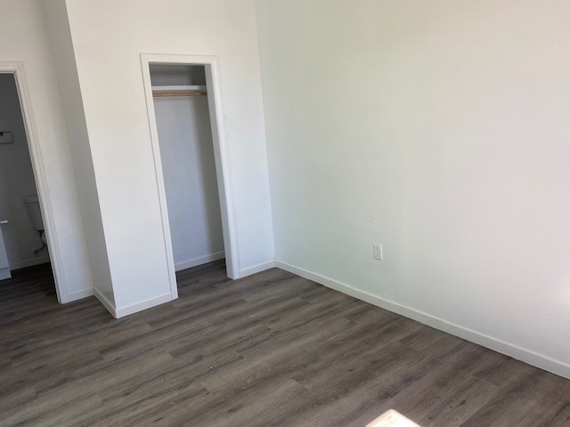 Bedroom 1 in unit 2 with attached bathroom.