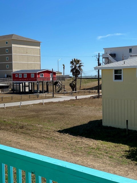 The view from 1st unit in duplex showing the seawall.