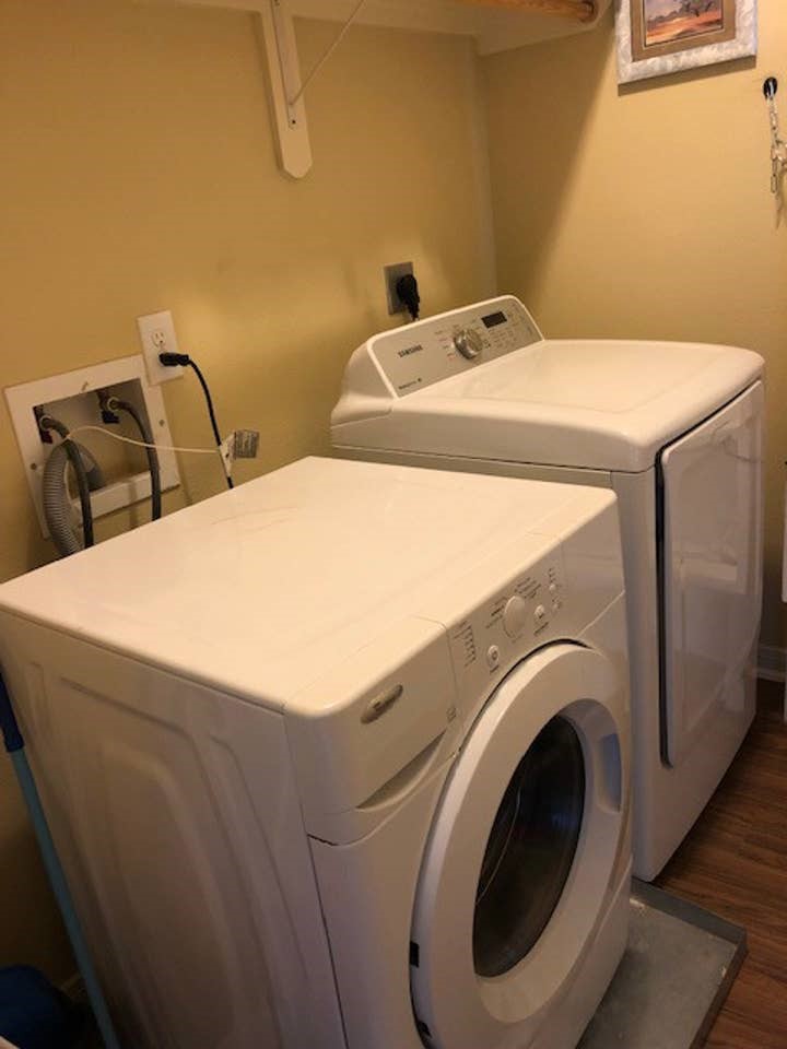 Laundry room with full size washer/dryer.