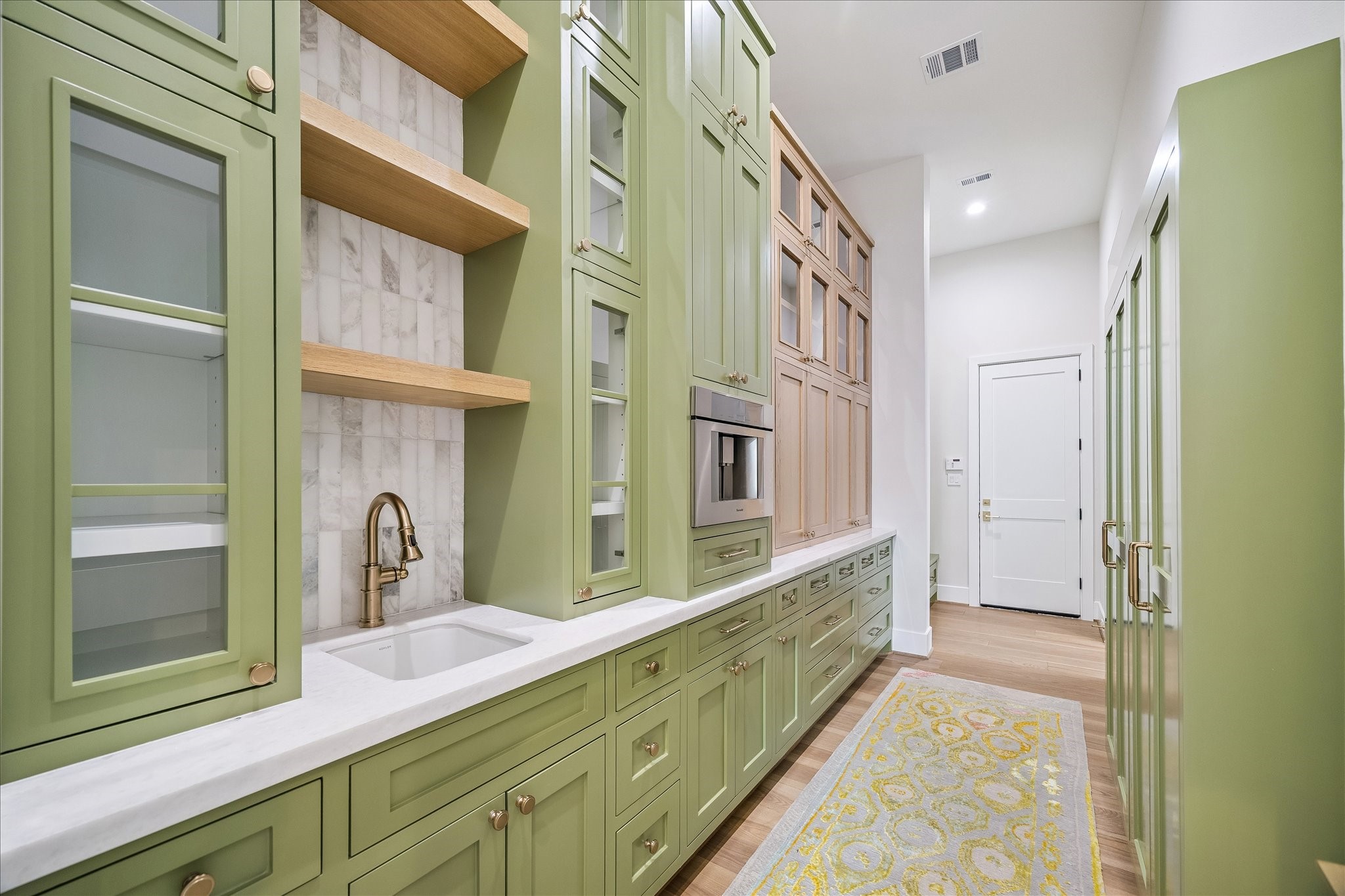 Butlers pantry serves as a refined, multifunction extension of the main kitchen.