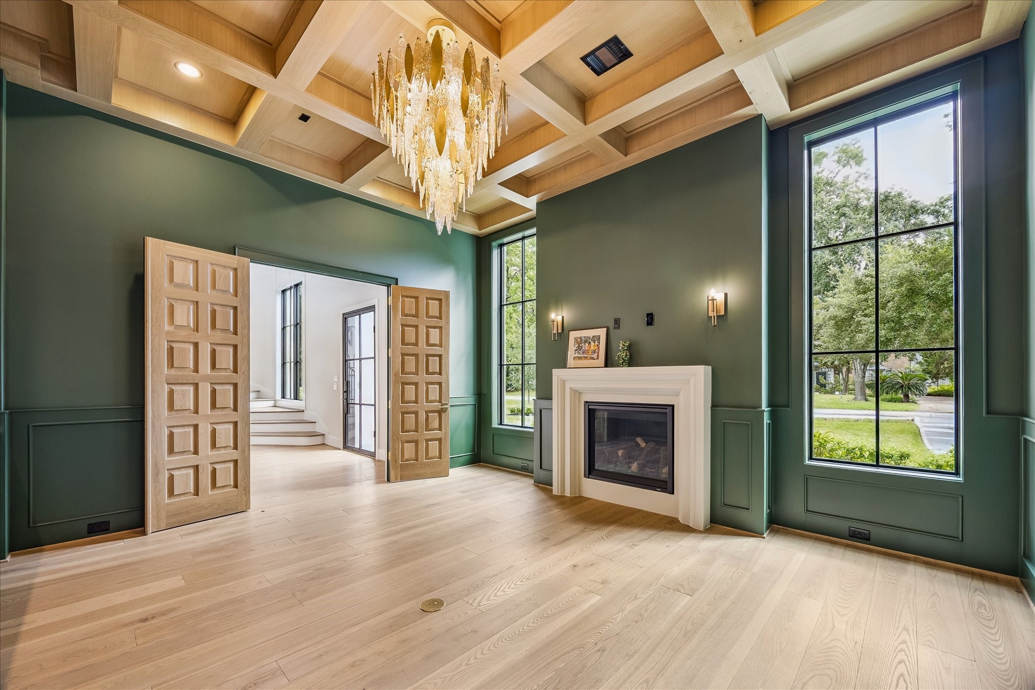 This property features custom built-ins that offer perfect solutions for organizing and showcasing your favorite items. The white oak double doors offer a grand entrance with their custom craftsmanship.