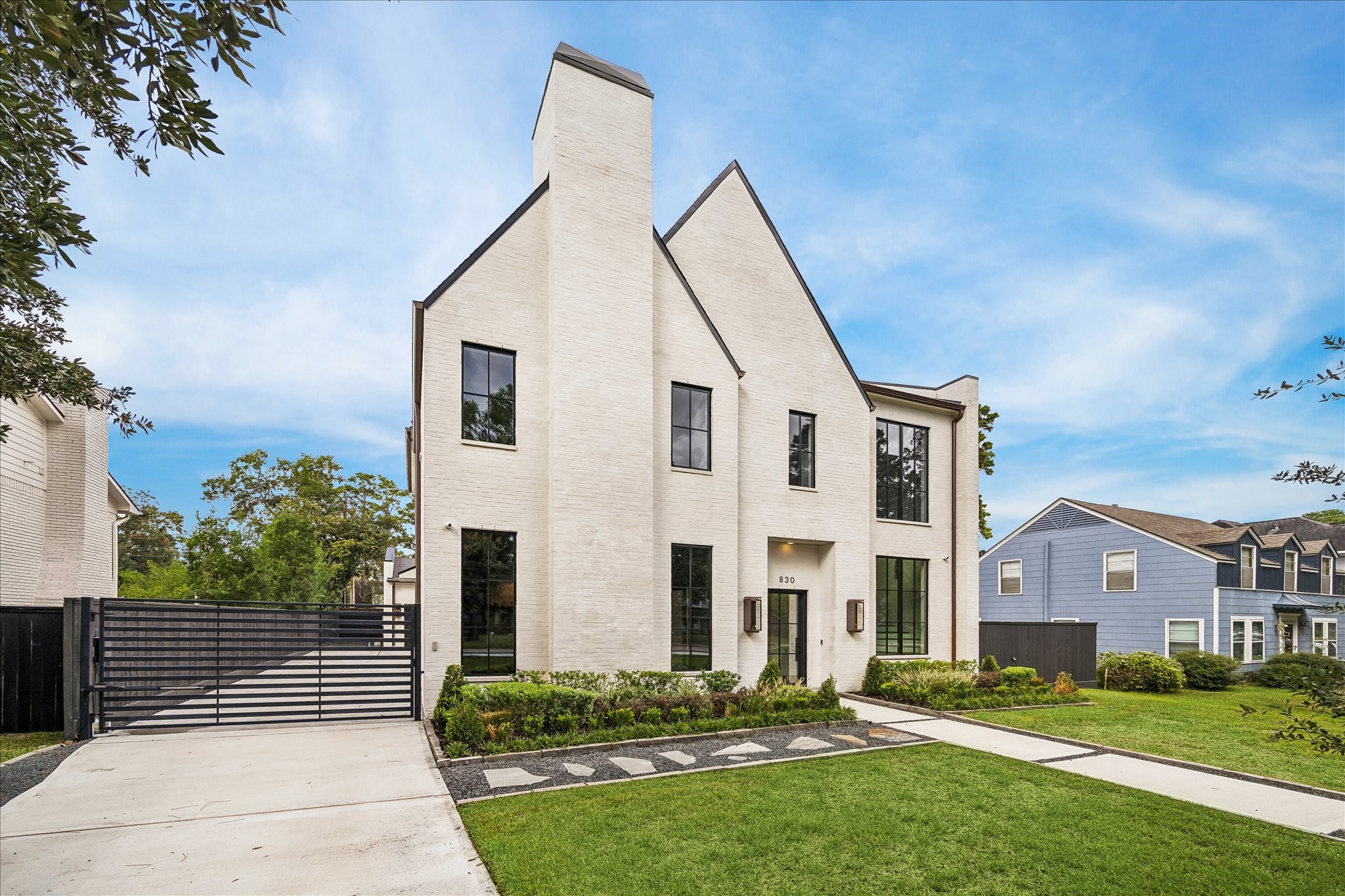 Discover this exceptional Garden Oaks home boasting luxury and modern amenities. The first floor impresses with 12-foot ceilings and a striking curved staircase framed by tall Pella Reserve windows. Enjoy seamless indoor-outdoor living with floor-to-ceiling glass connecting the living room, kitchen, and backyard. The chef's kitchen features a island and a full Thermador suite, including a 48-inch Pro Grand range and built-in coffee system.
