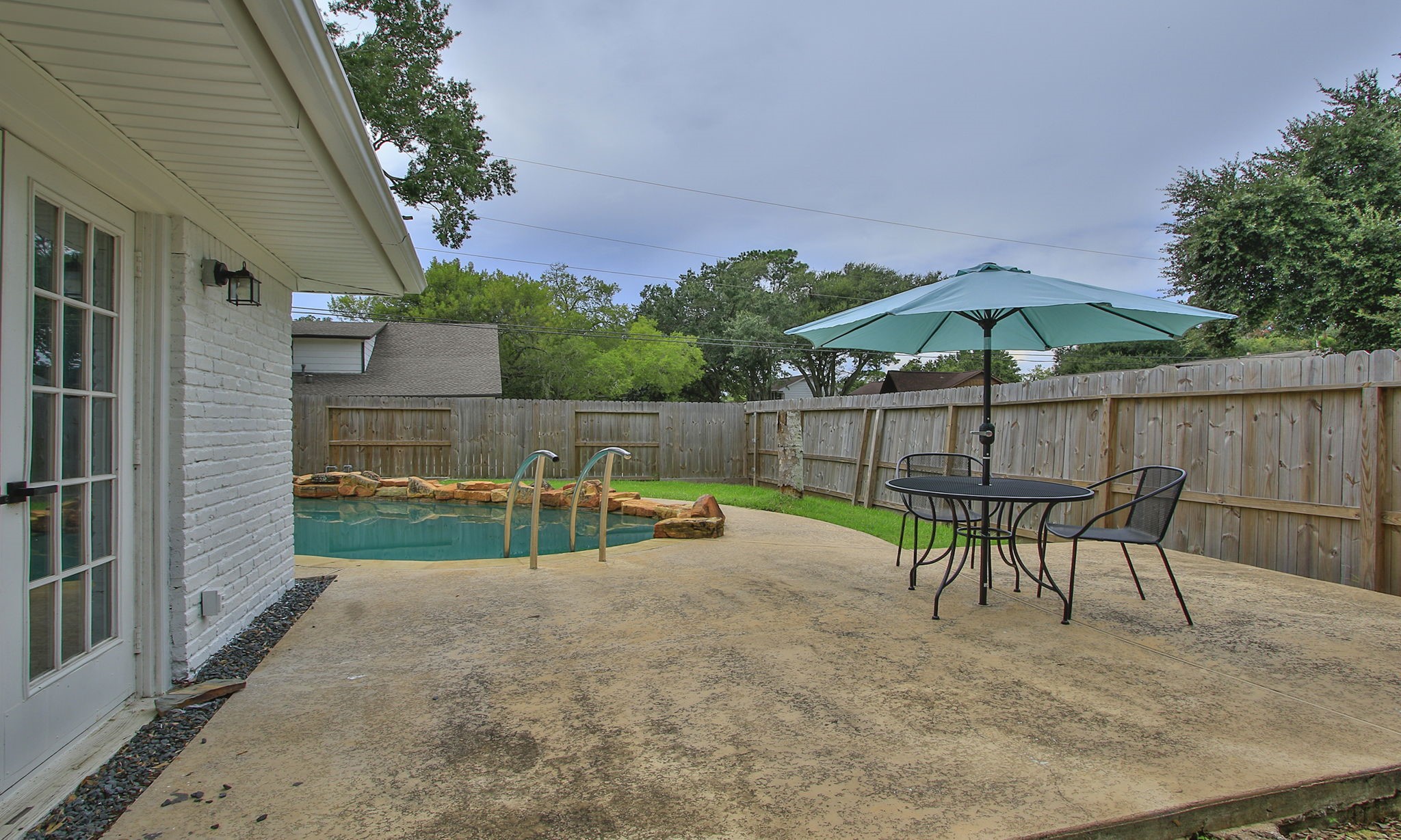 Just outside the main bedroom, an intimate space by the pool.