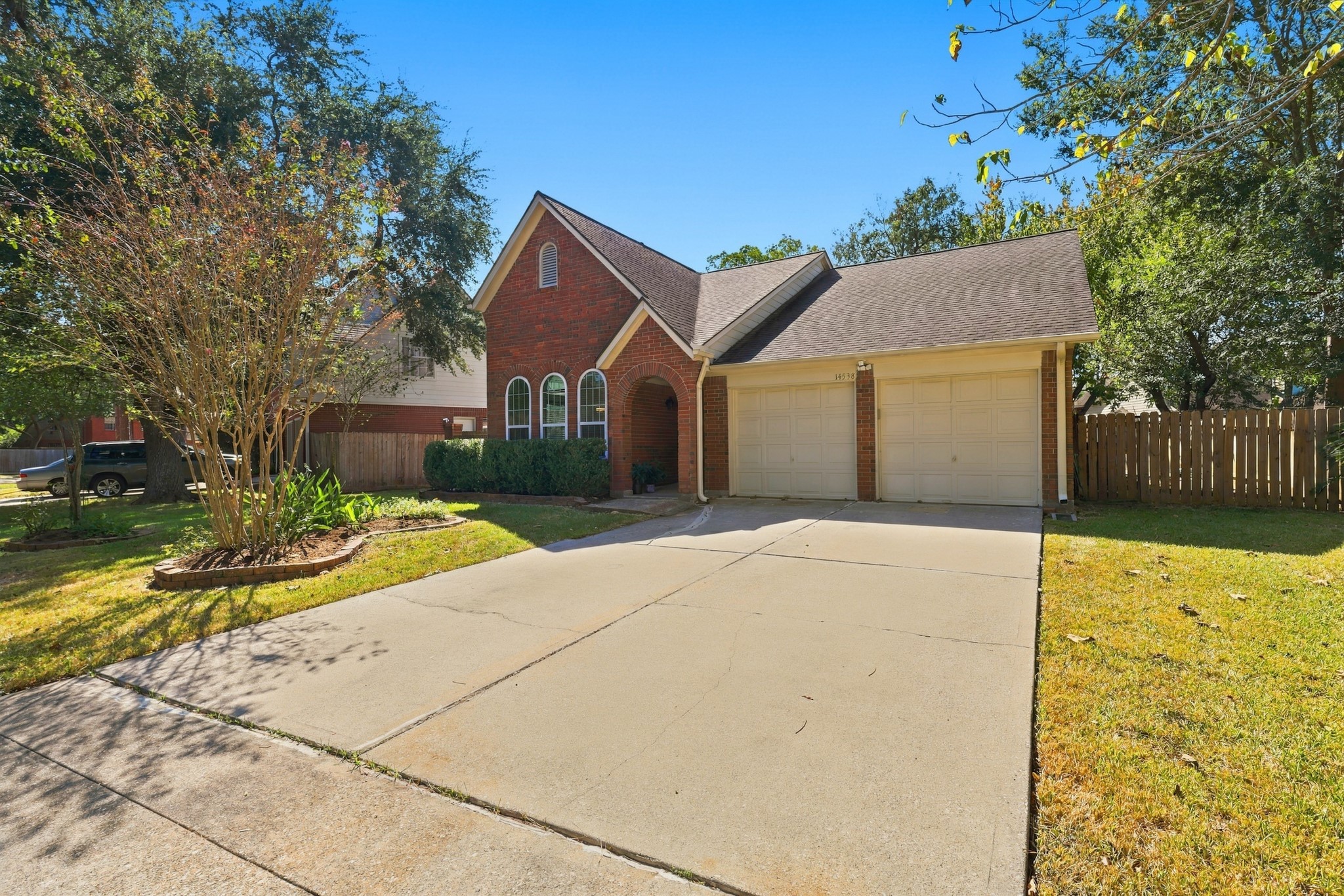 You will love this home's attractive brick exterior, distinctive arched windows, welcoming covered entry, and mature shade trees. Established landscaping, a generous driveway, and an attached two-car garage add to the home's curb appeal and everyday convenience. You will love this home's attractive brick exterior, distinctive arched windows, welcoming covered entry, and mature shade trees. Established landscaping, a generous driveway, and an attached two-car garage add to the home's curb appeal and everyday convenience.