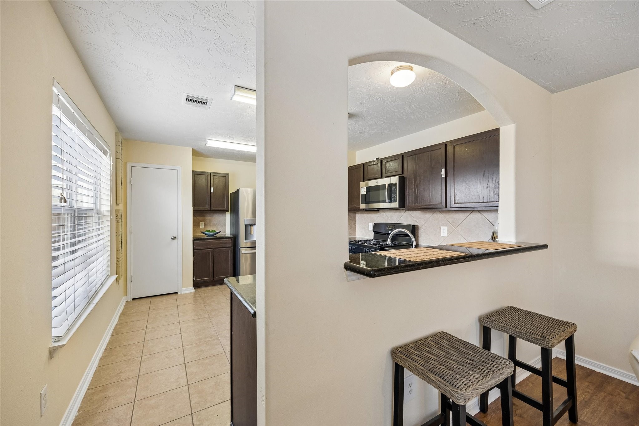 Cozy Breakfast nook with a convenient counter for casual dining and morning coffee