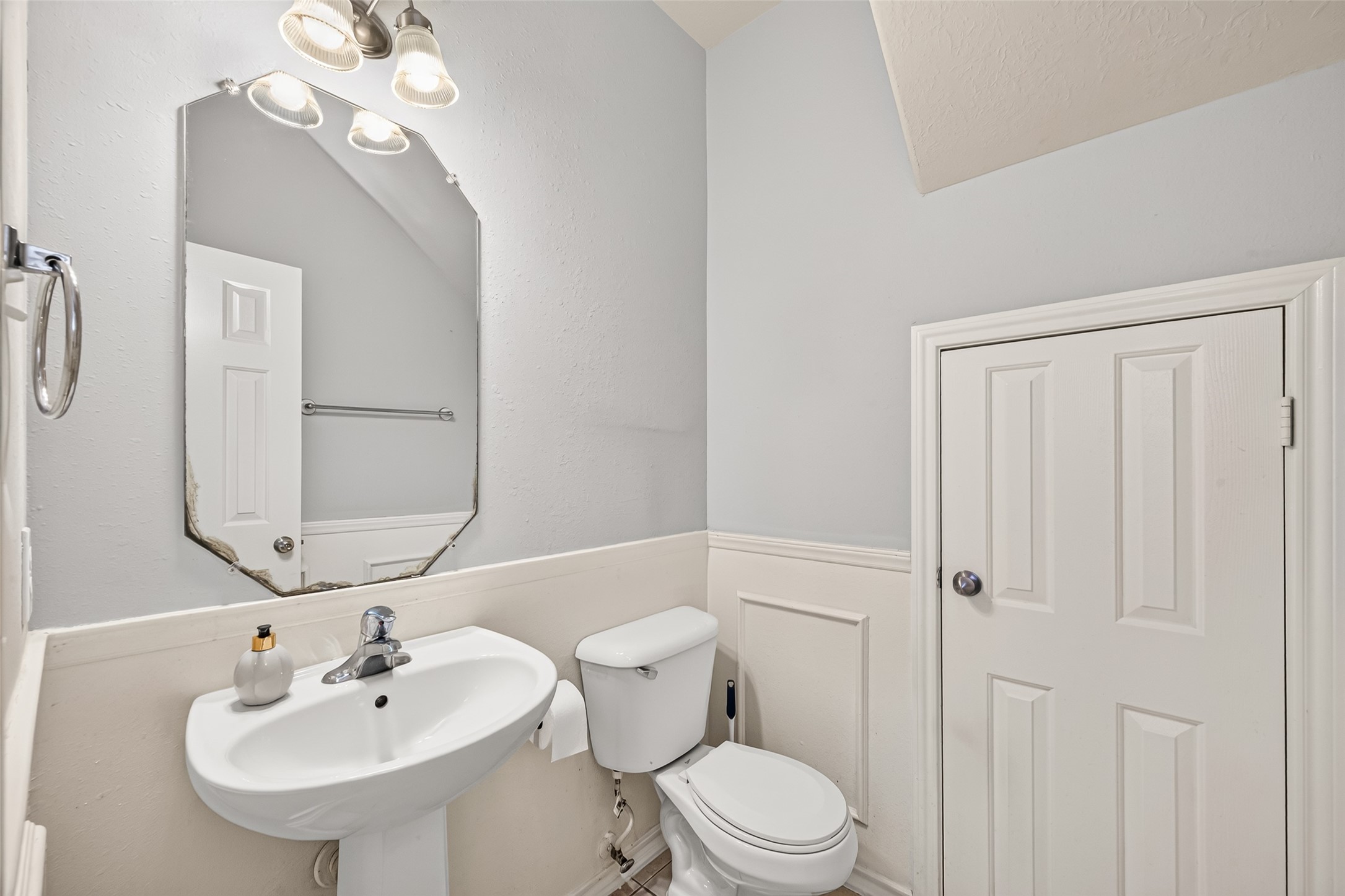 Half bath downstairs right by the entrance of the home