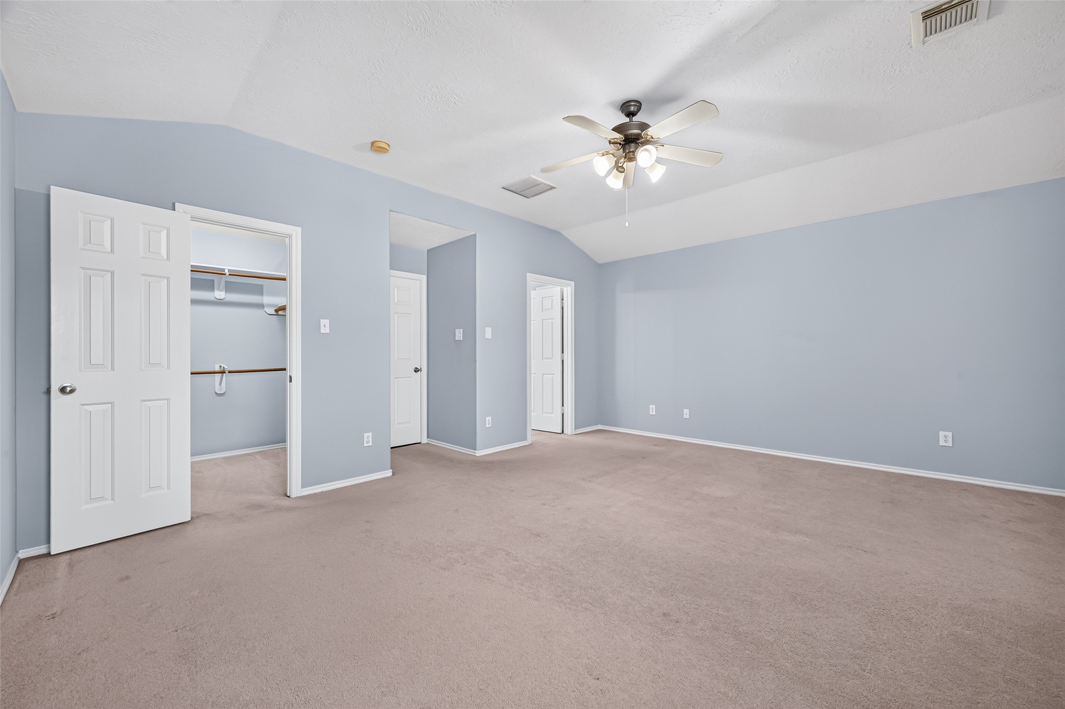 Another view of the primary bedroom
