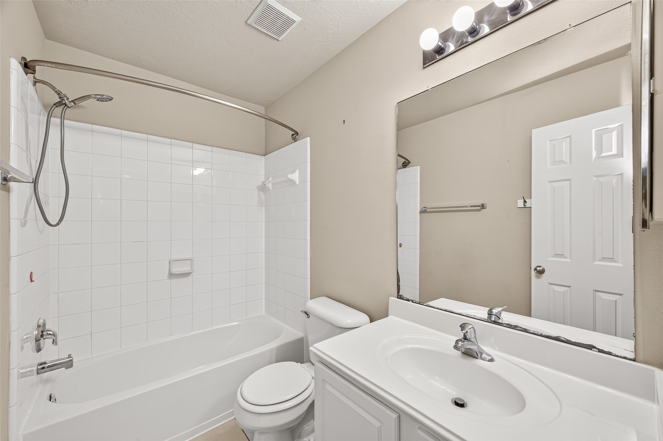 Bathroom with tub and shower combo