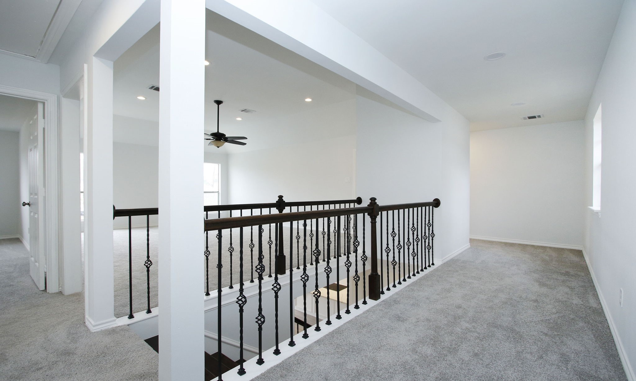 The landing at the top of the stairs would make a great open office or study area
