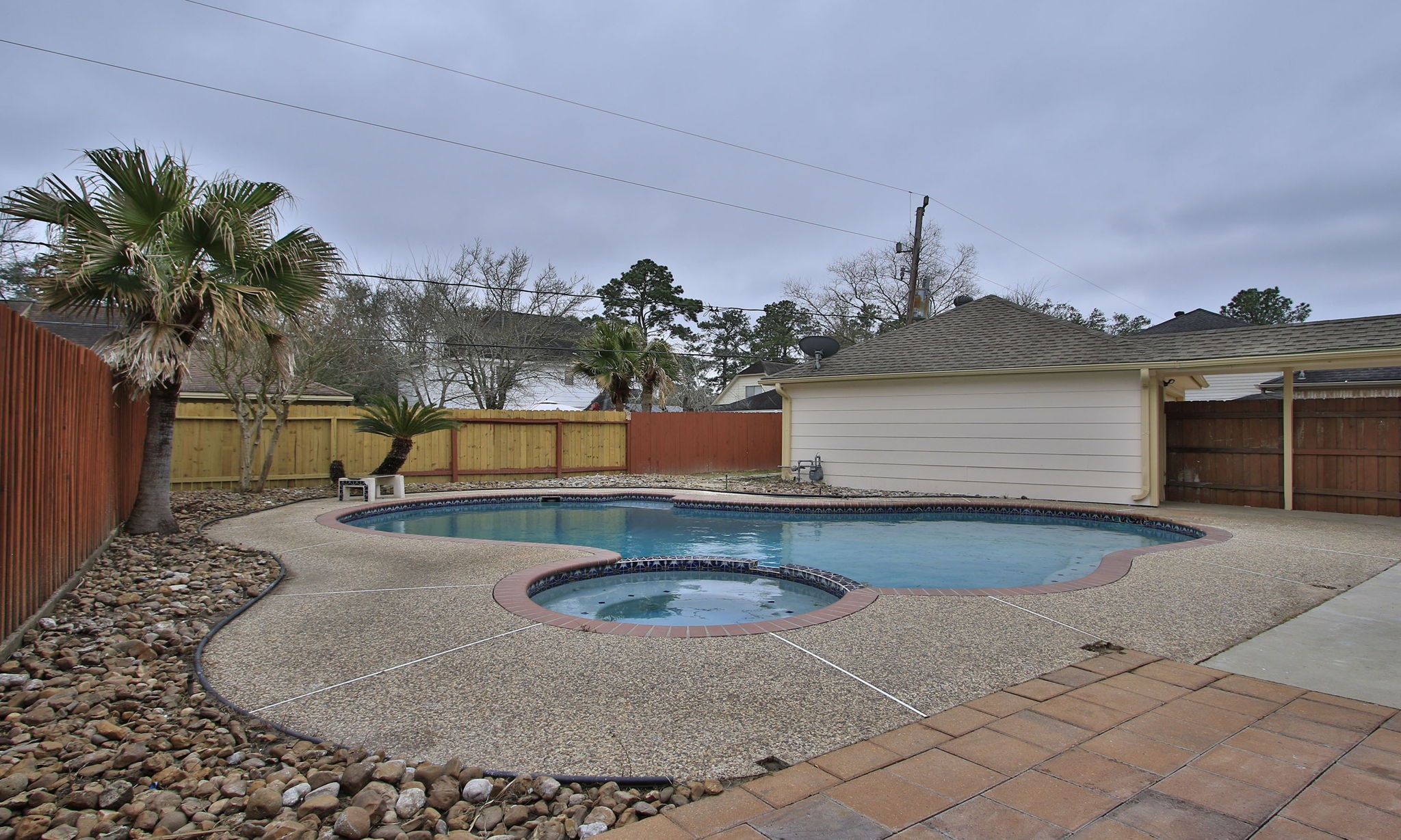 The pool has an attached spa