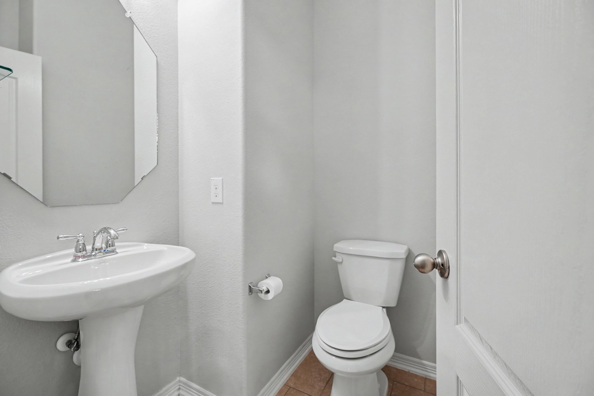 Half bath located downstairs right around the corner from the kitchen.