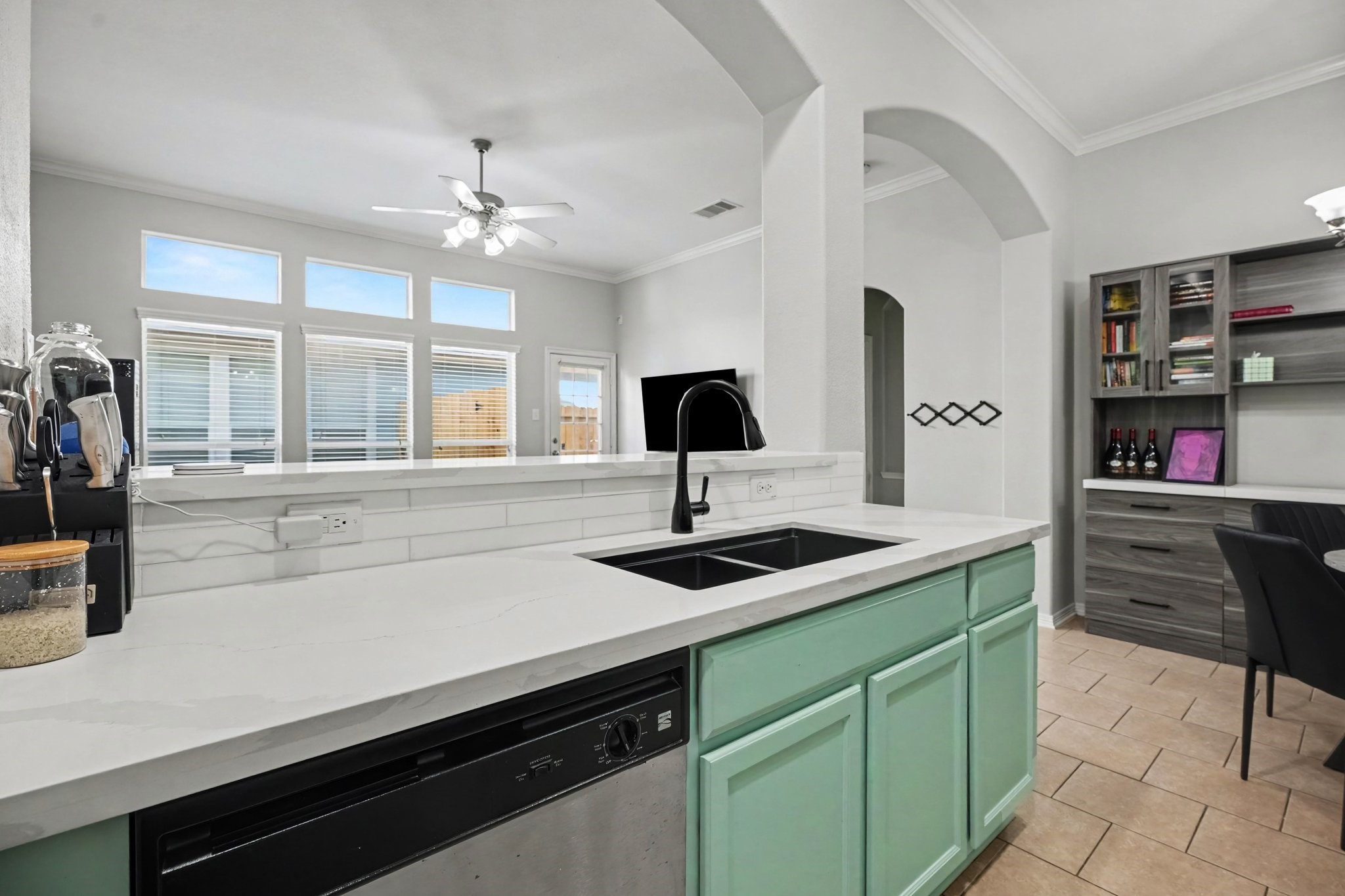 Recently remodeled featuring stainless steel appliances, a gas range, and an open layout overlooking the living room.