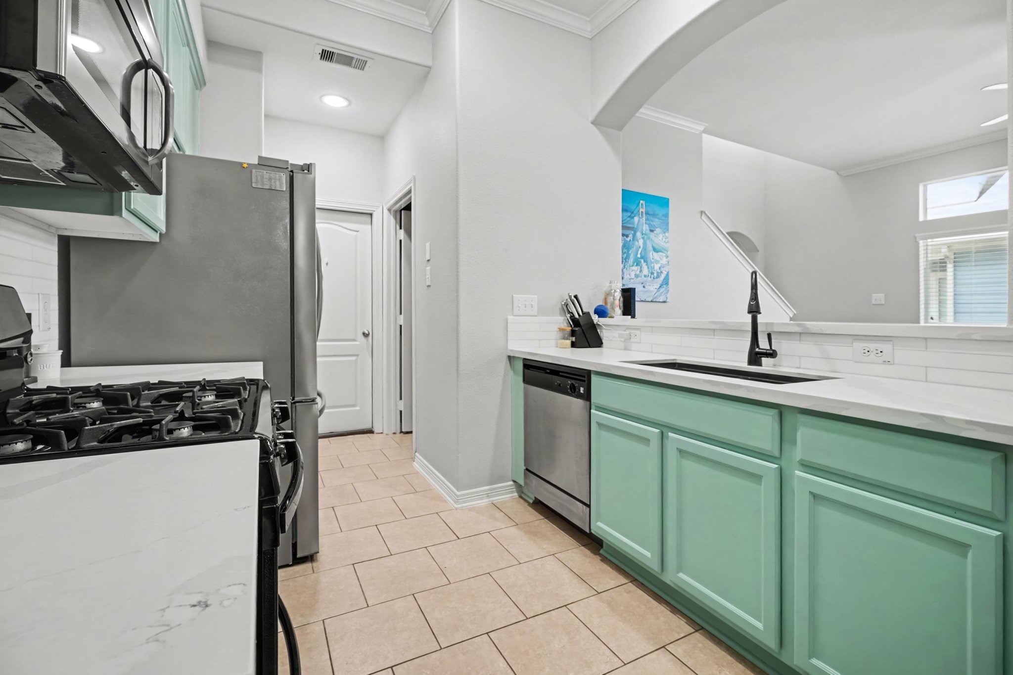 Kitchen leads to full sized laundry room and access to the garage.