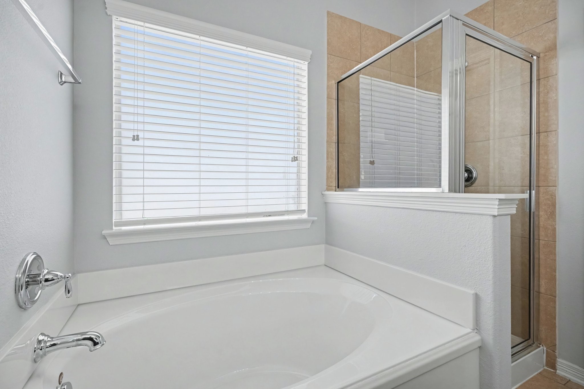 Primary bathroom stand alone shower & soaking tub.