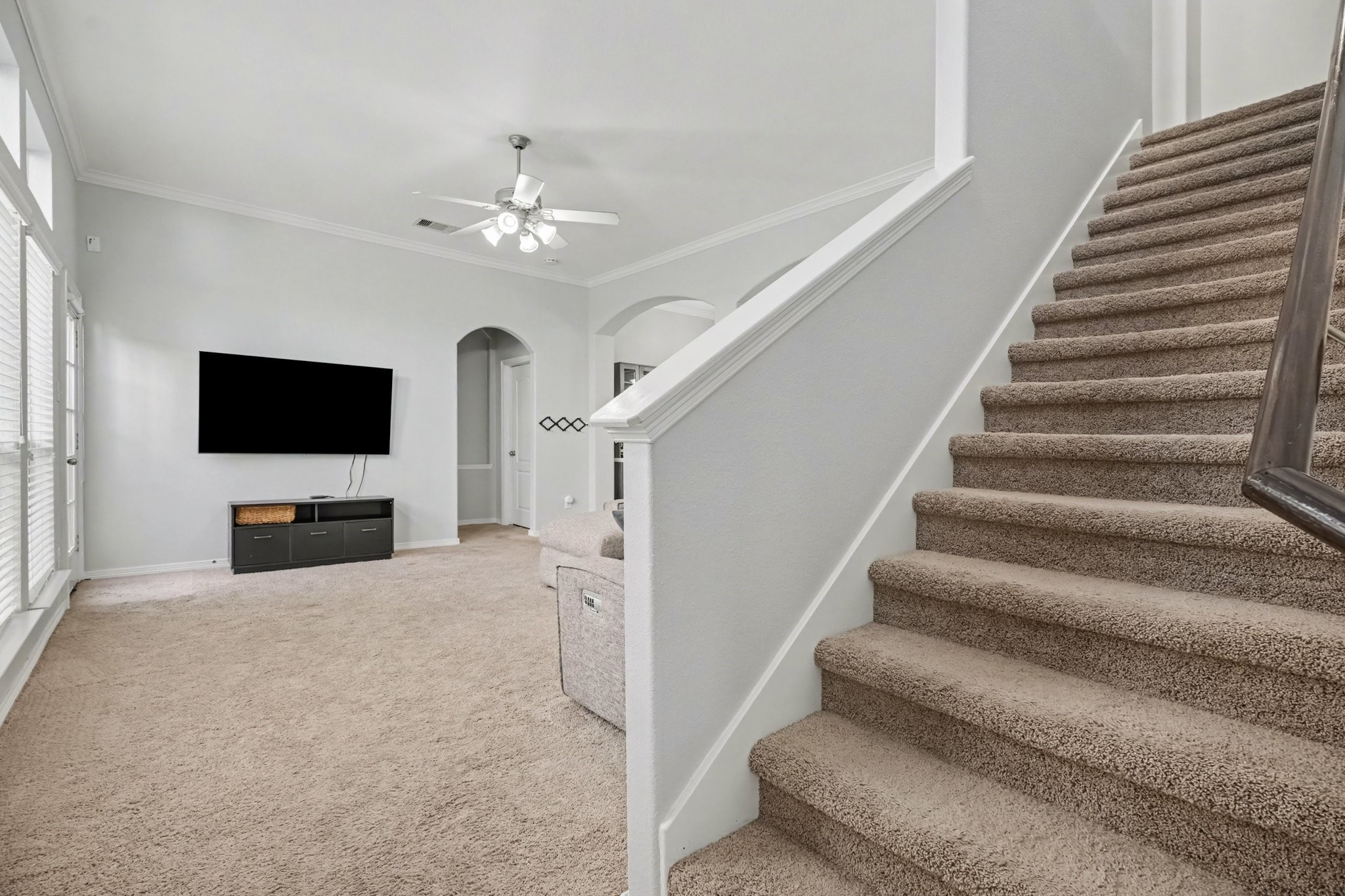 Entry leading into the living area and upstairs.