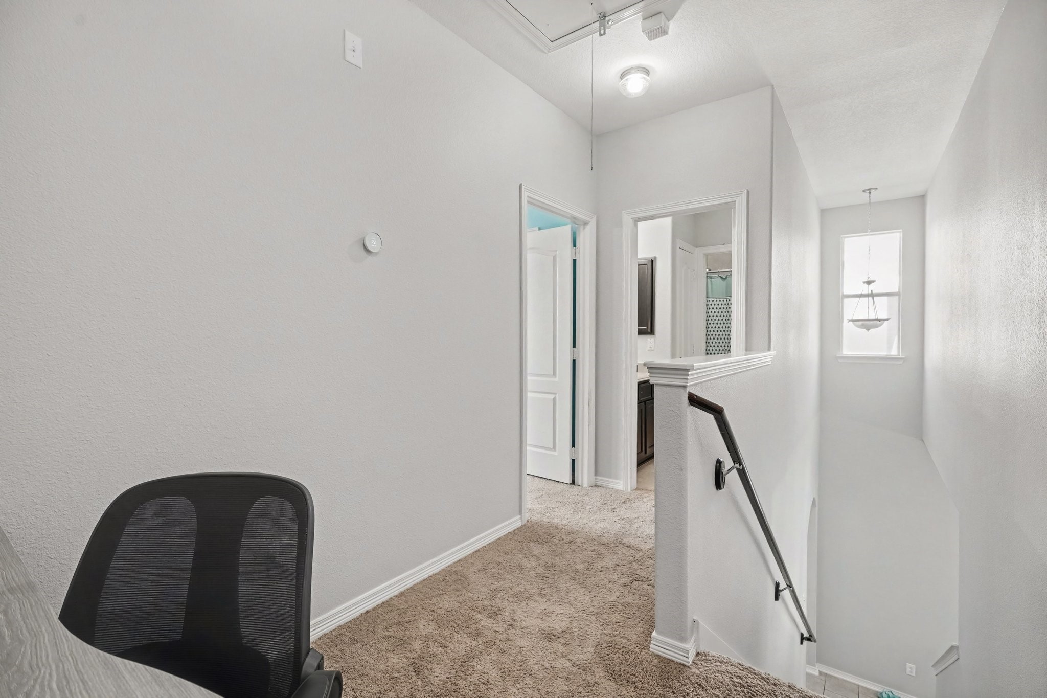Small office space located at the top of the stairs.