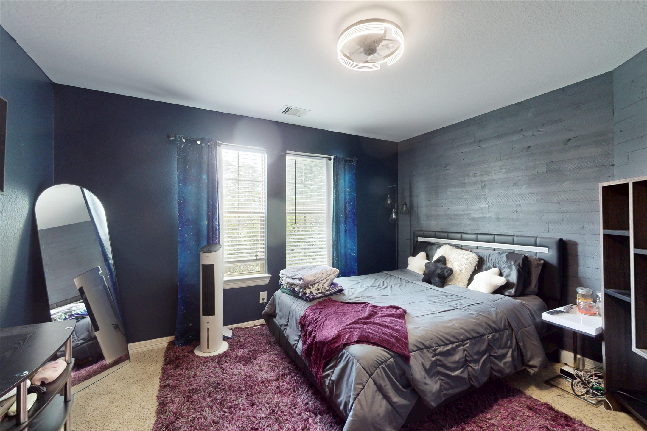 Secondary bedroom with accent wall