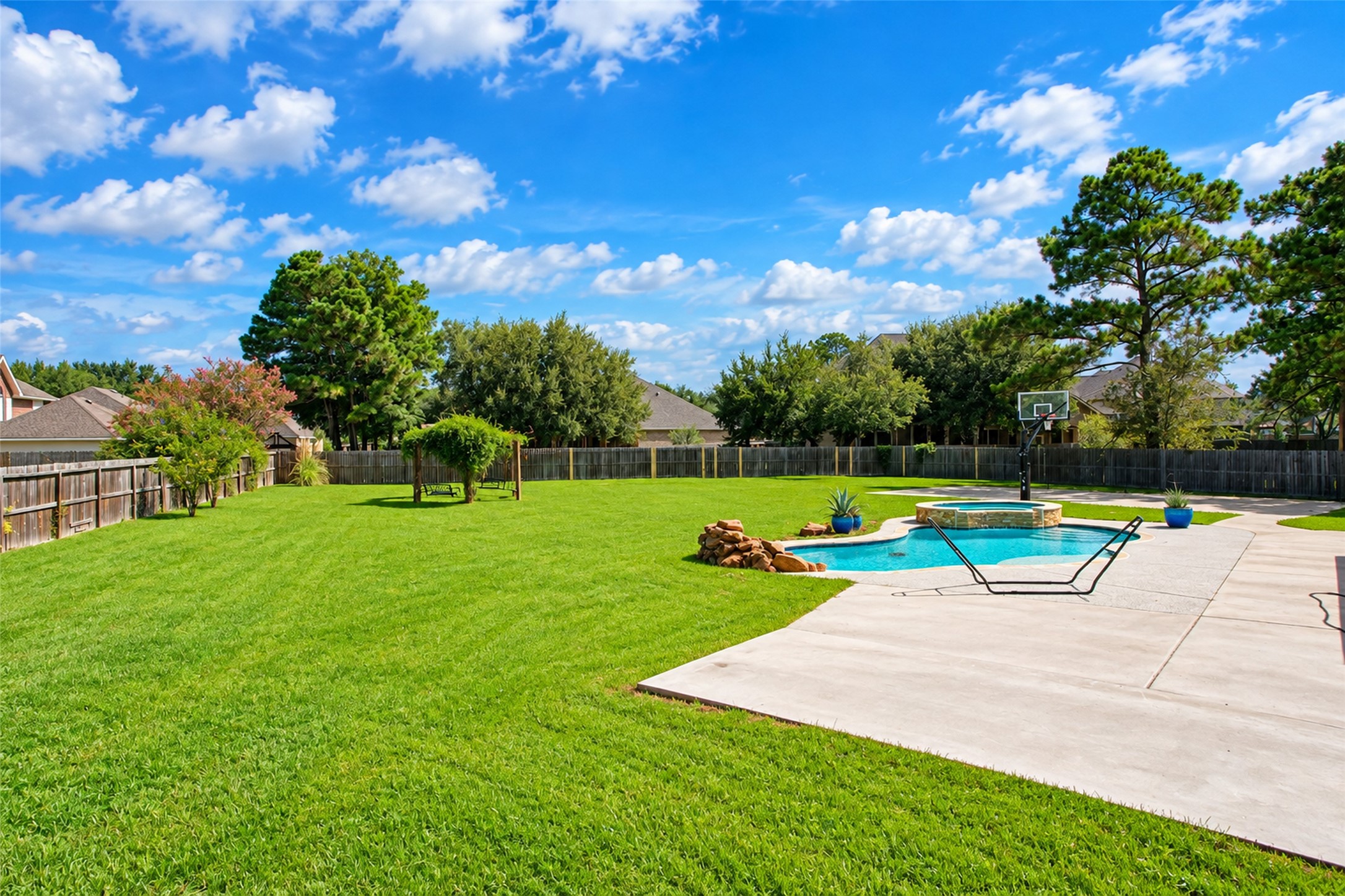 Back yard - pool, spa and privacy-fenced lawn