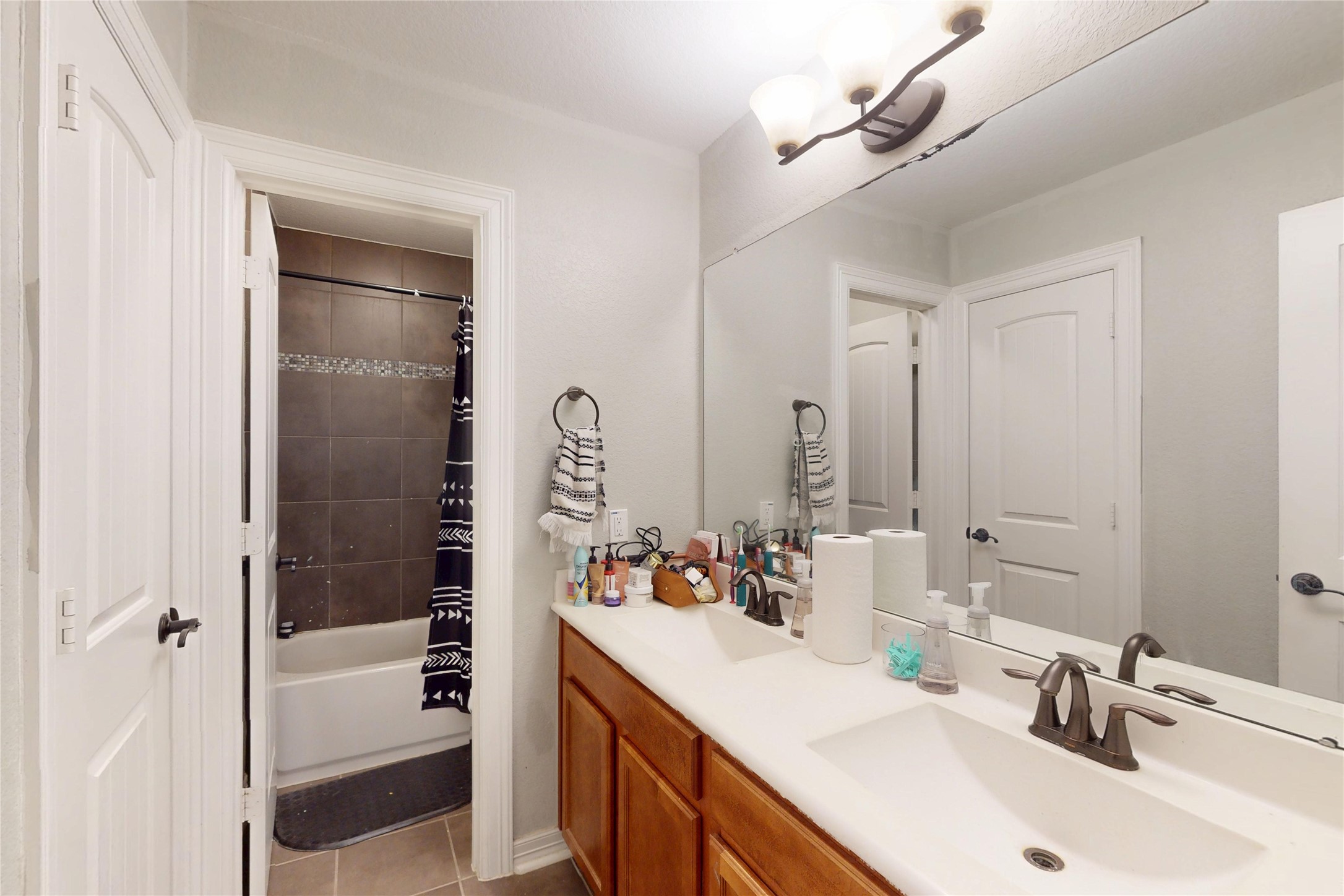 Secondary bath with double vanity and tub-shower