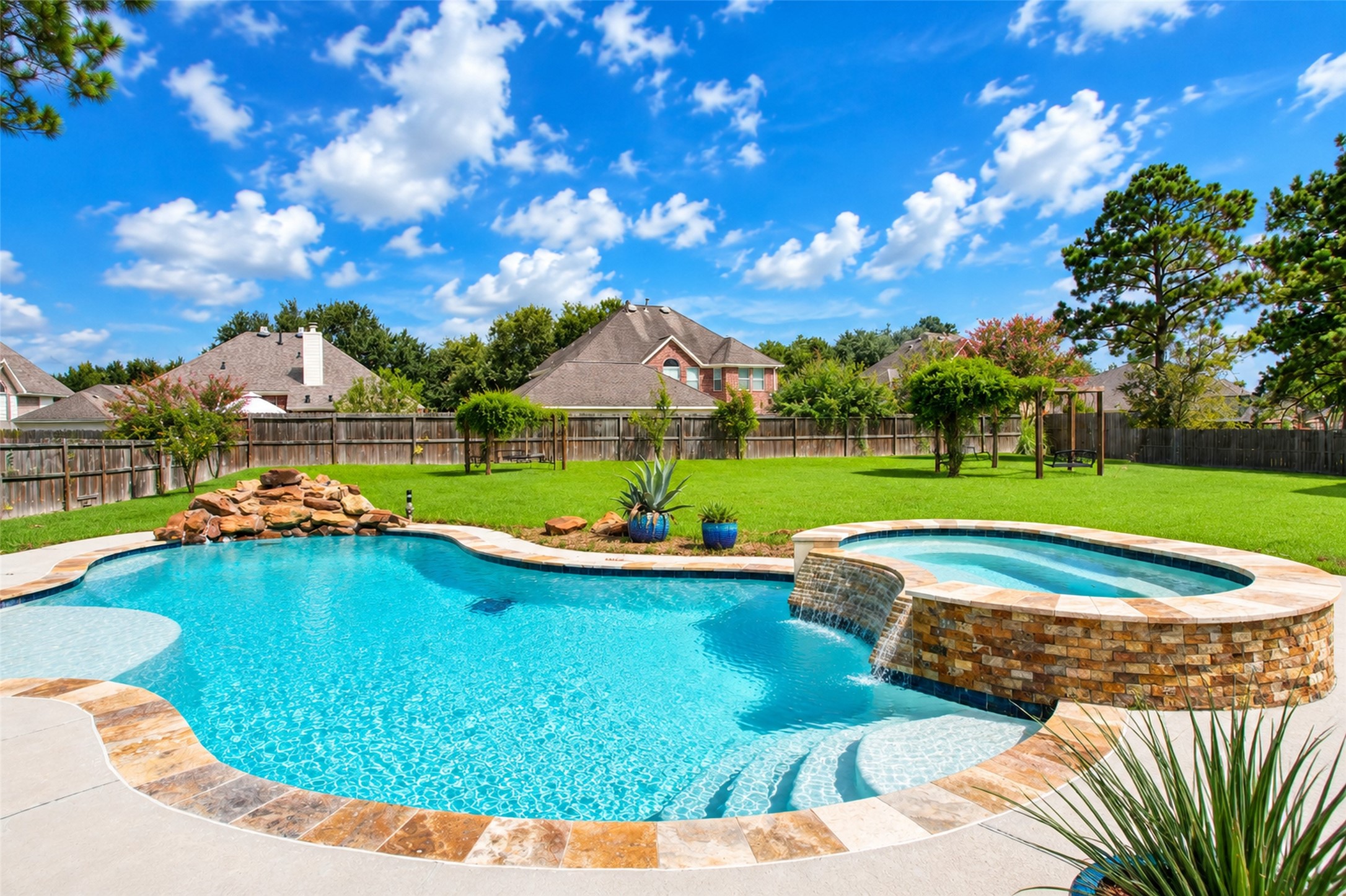 Pool and spa with the full depth of the yard behind