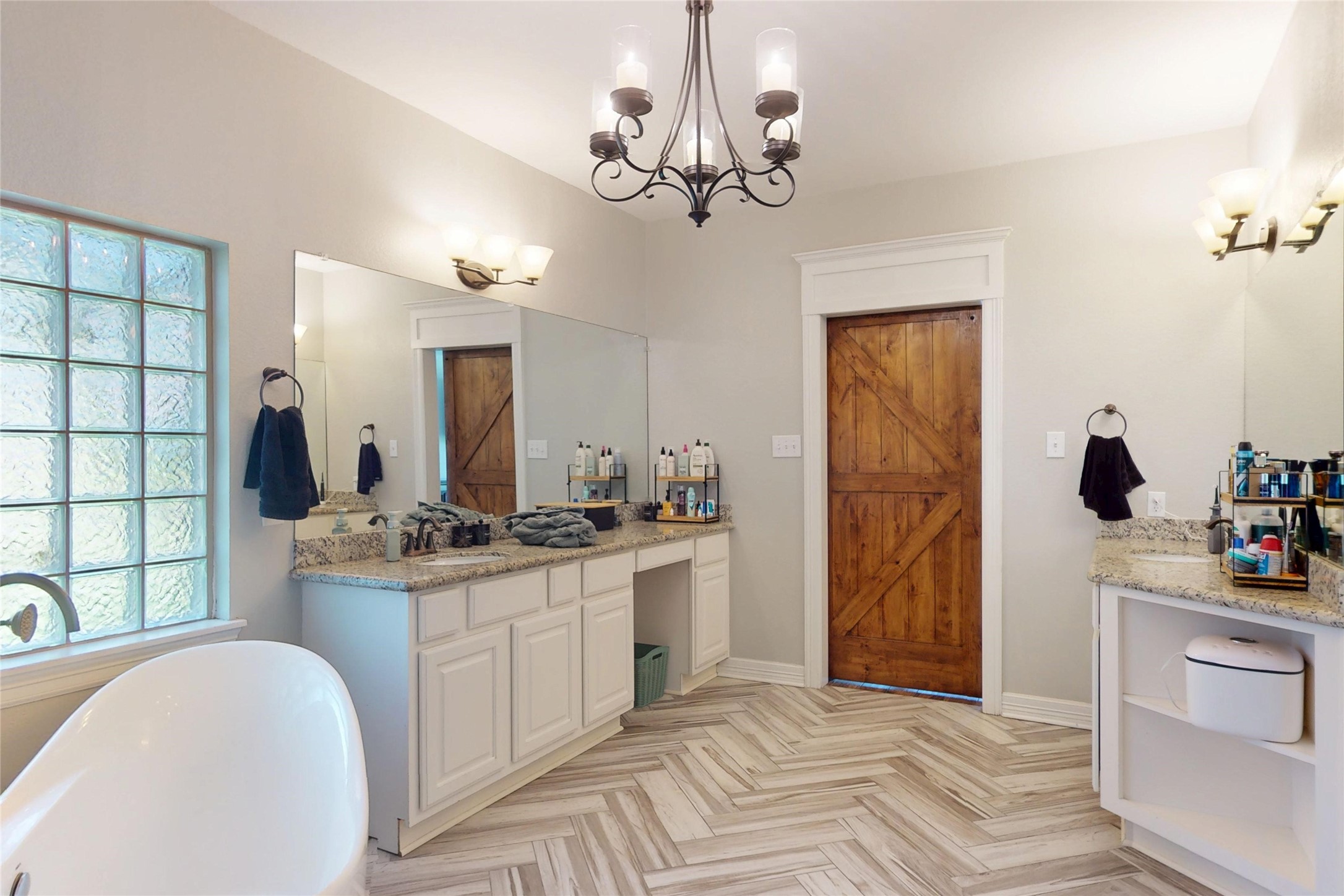 Primary bath double vanity with seated station and barn door