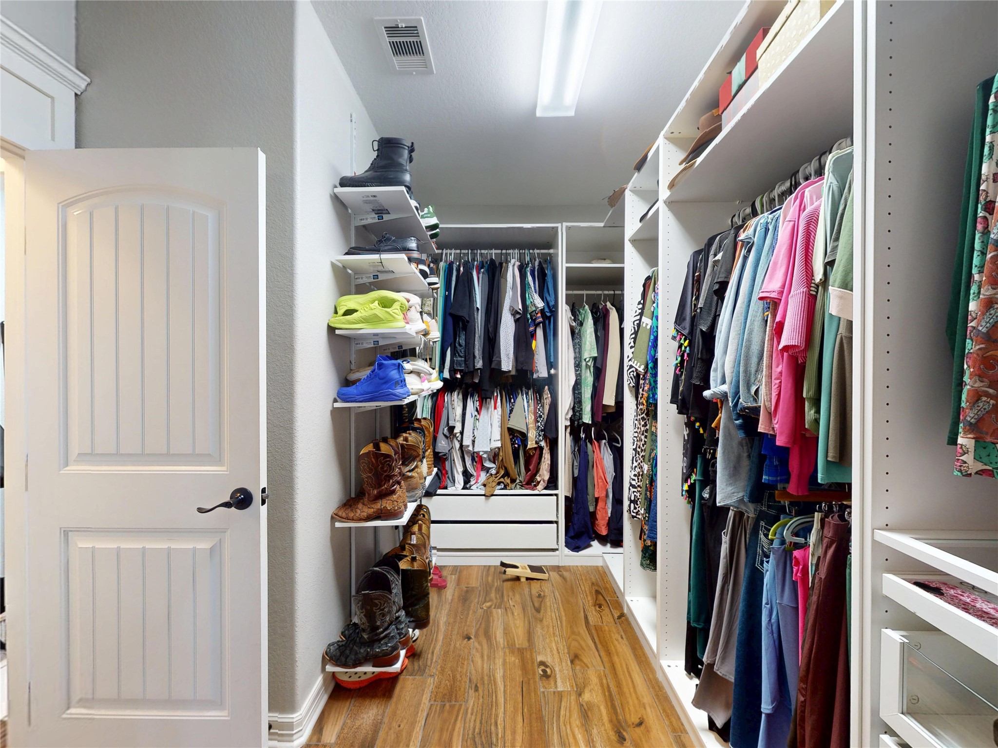 Oversized closet with built-in shelving on both sides