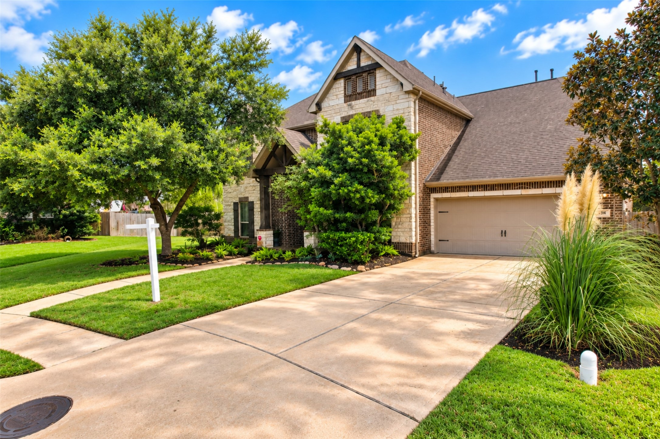 Front elevation and extended driveway to the attached garage