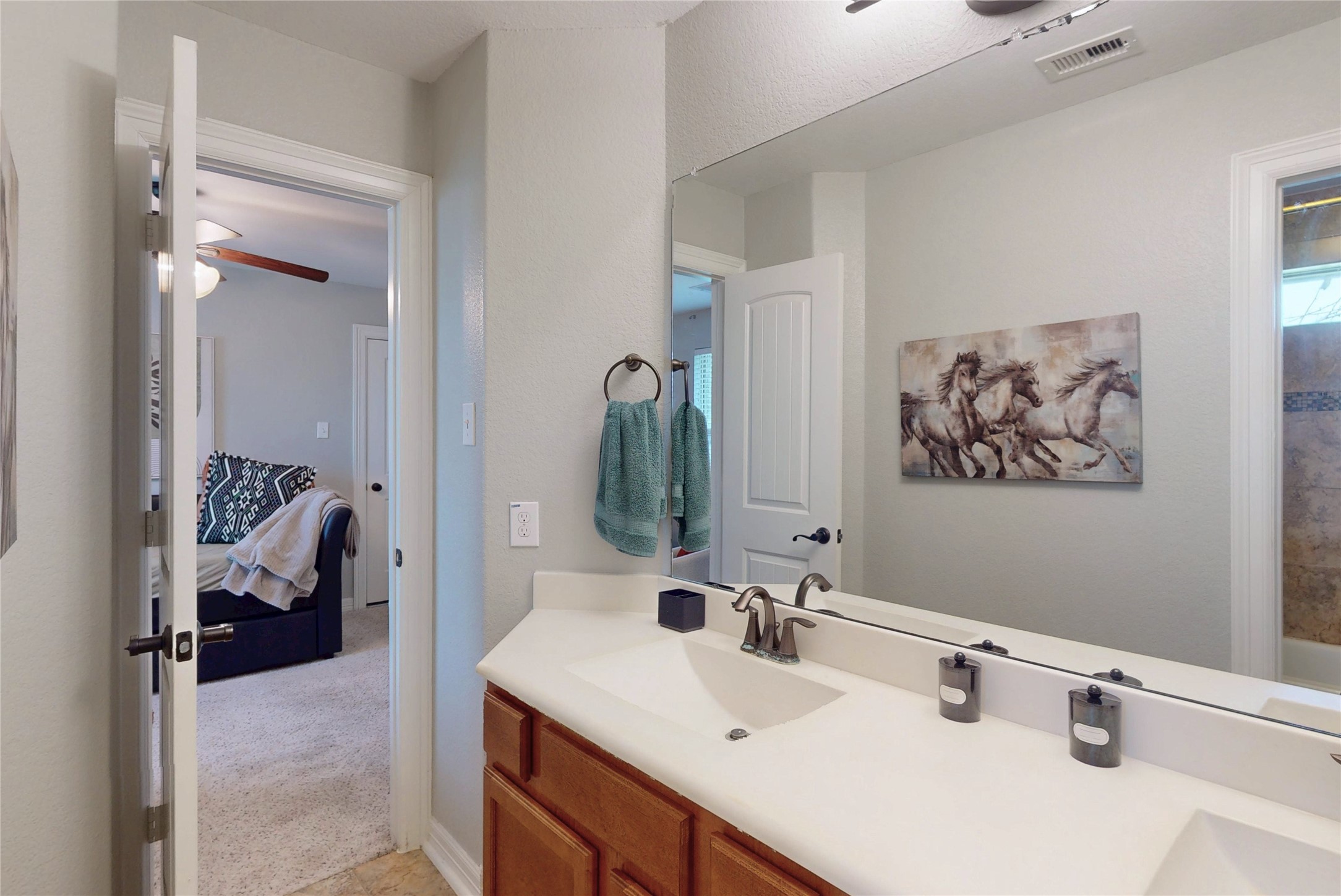 Secondary bath double vanity opening to a bedroom