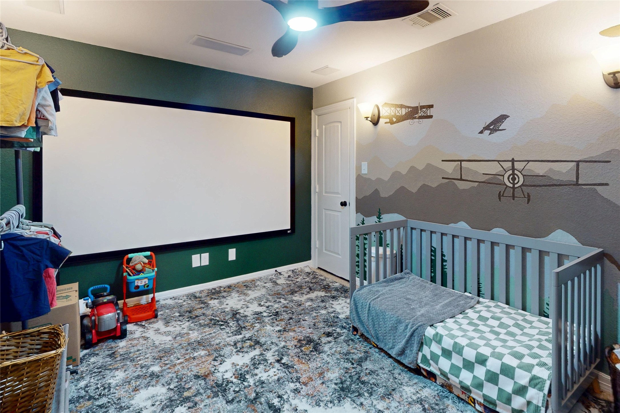 Secondary bedroom with mural accent wall