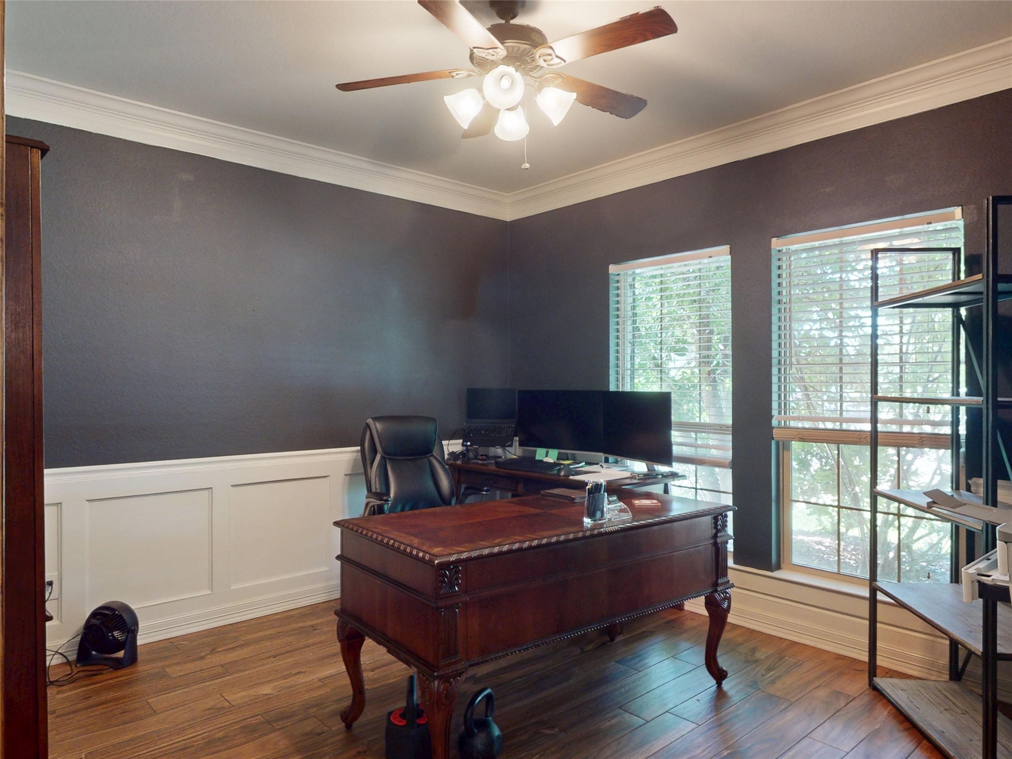 Private study with wainscoting and crown molding