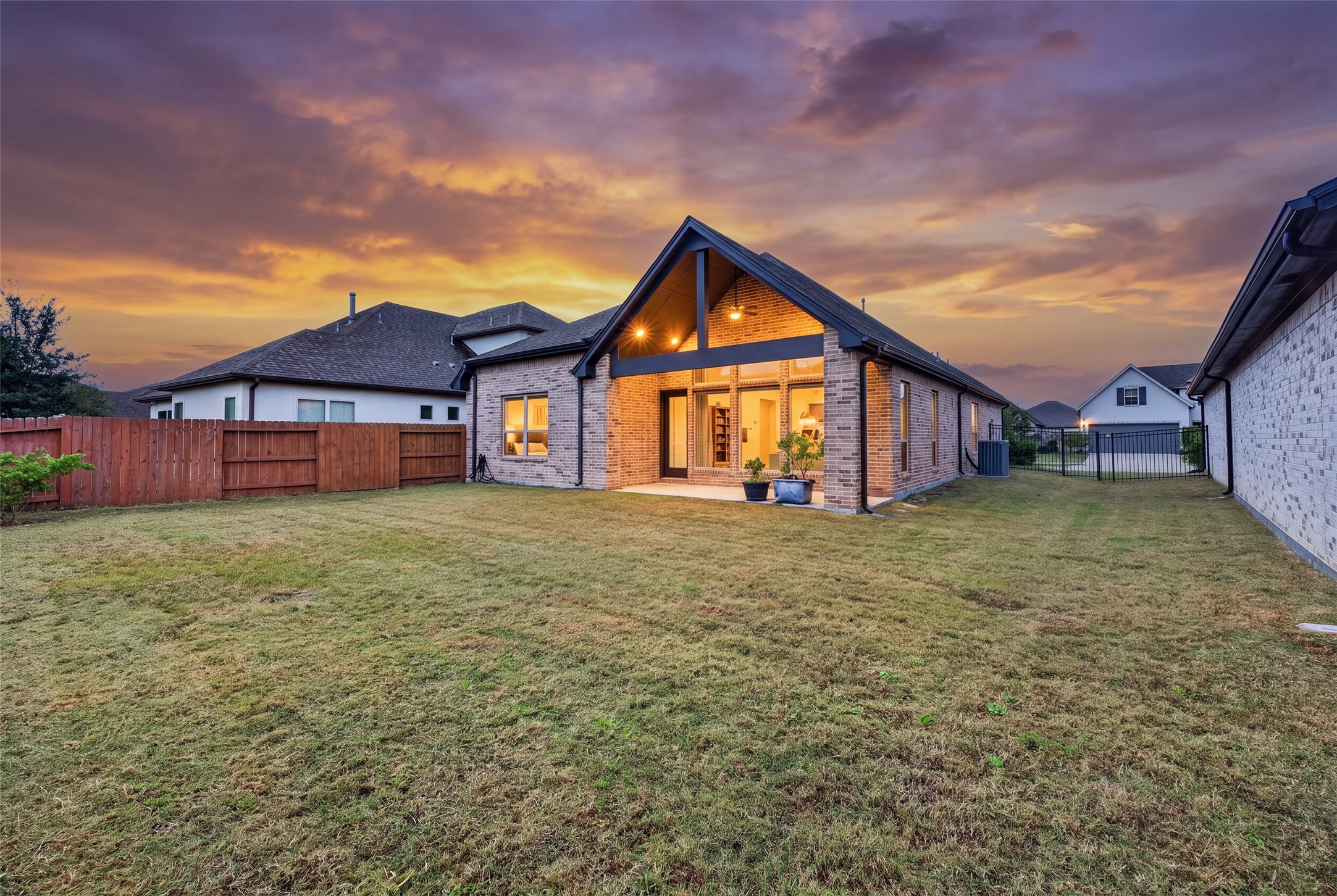 Step outside into an exceptionally wide backyard complemented by a convenient side yard for easy access and utility.