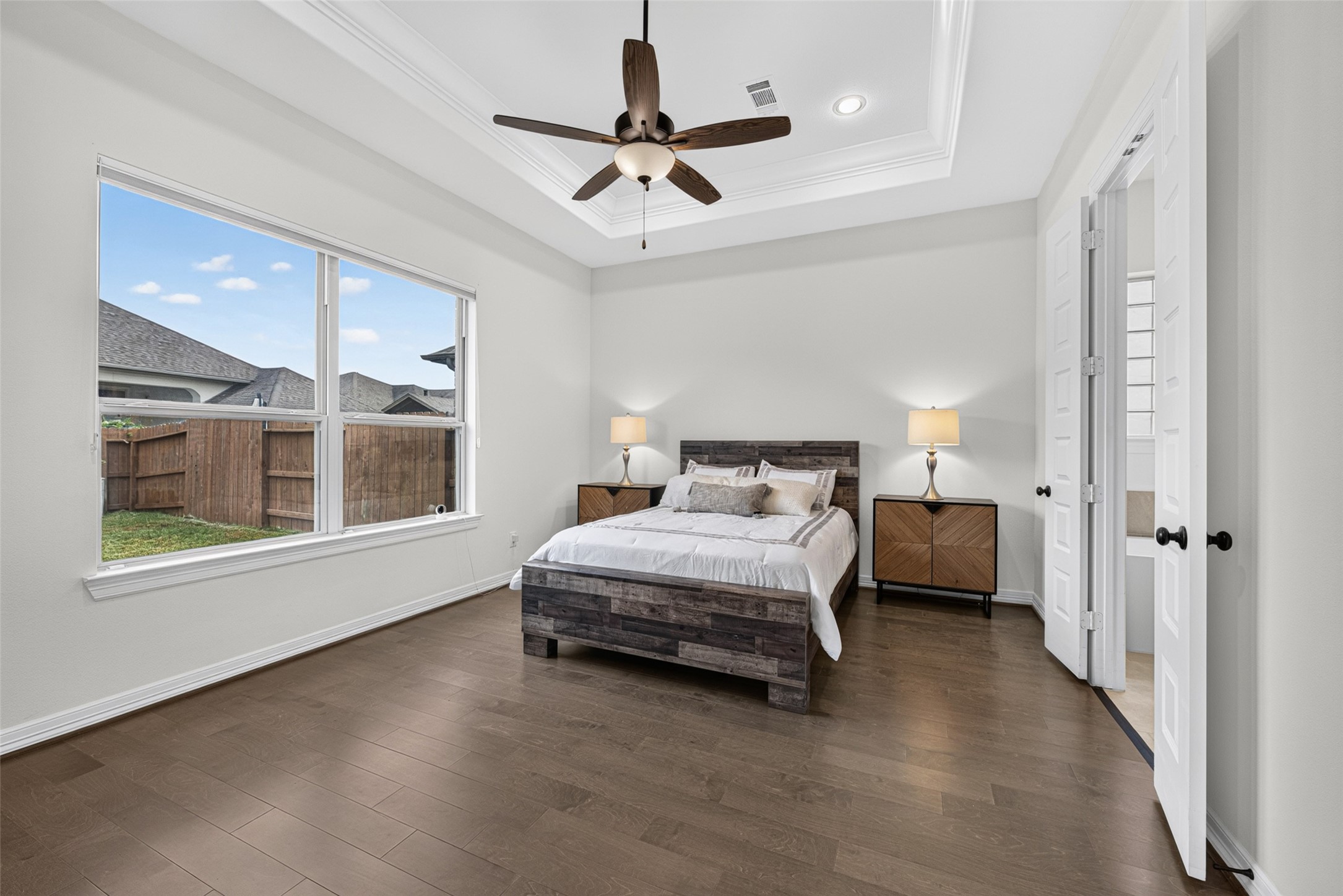 Your private retreat awaits in the spacious primary bedroom, designed with serene comfort in mind.