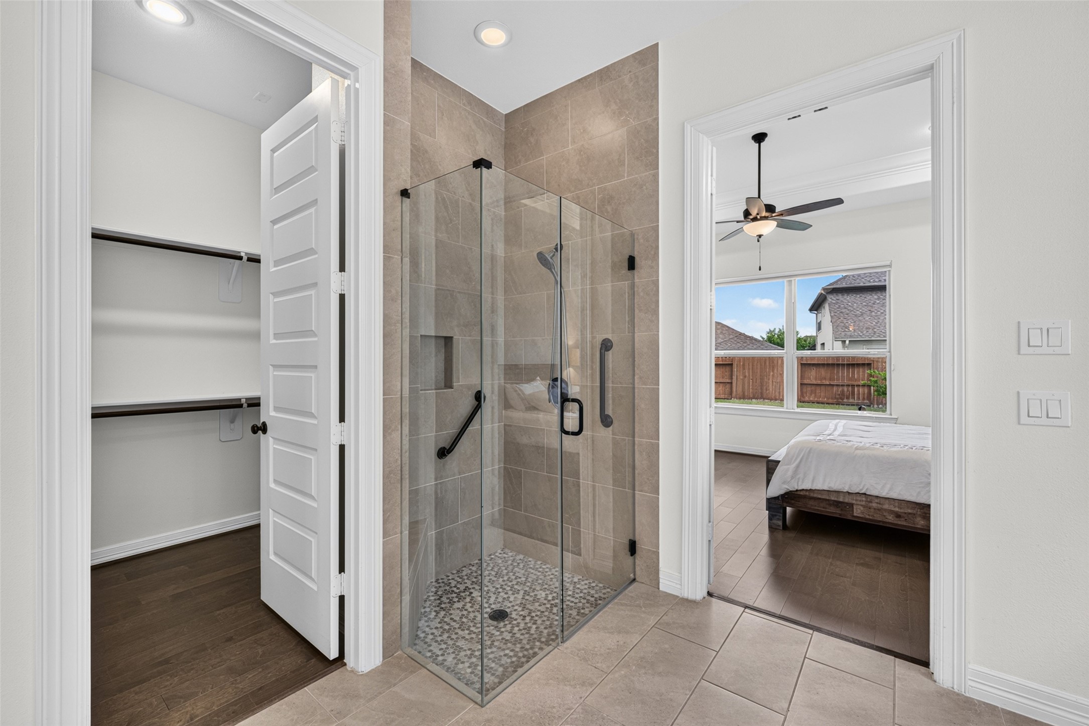 Enjoy a daily spa experience in the spacious walk-in shower, finished with clean lines and modern tile work.