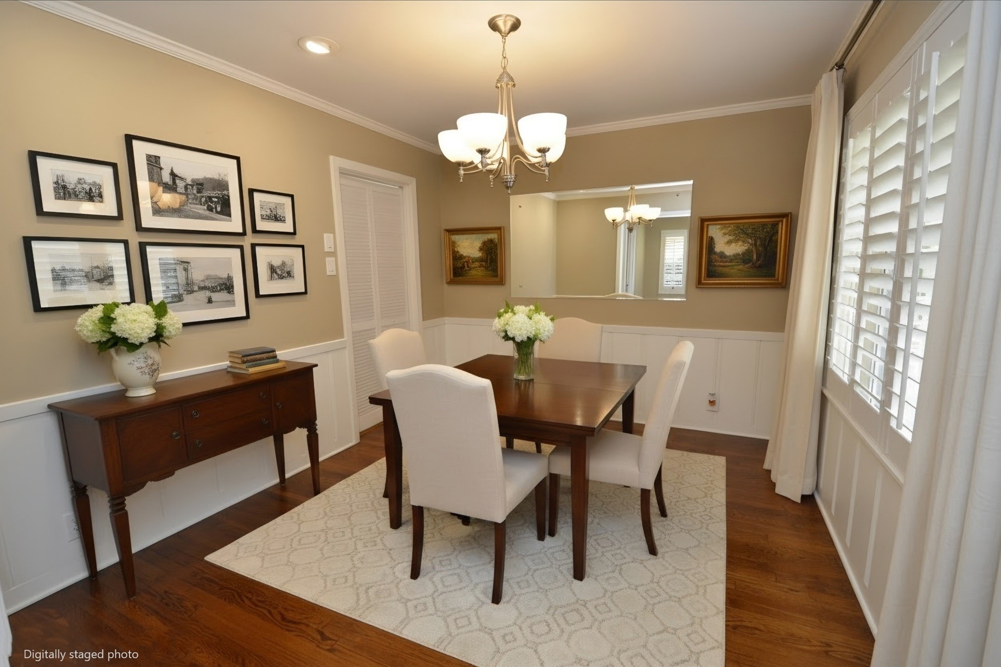 Elegant dining room featuring dimmable recessed lighting and classic wainscoting.
