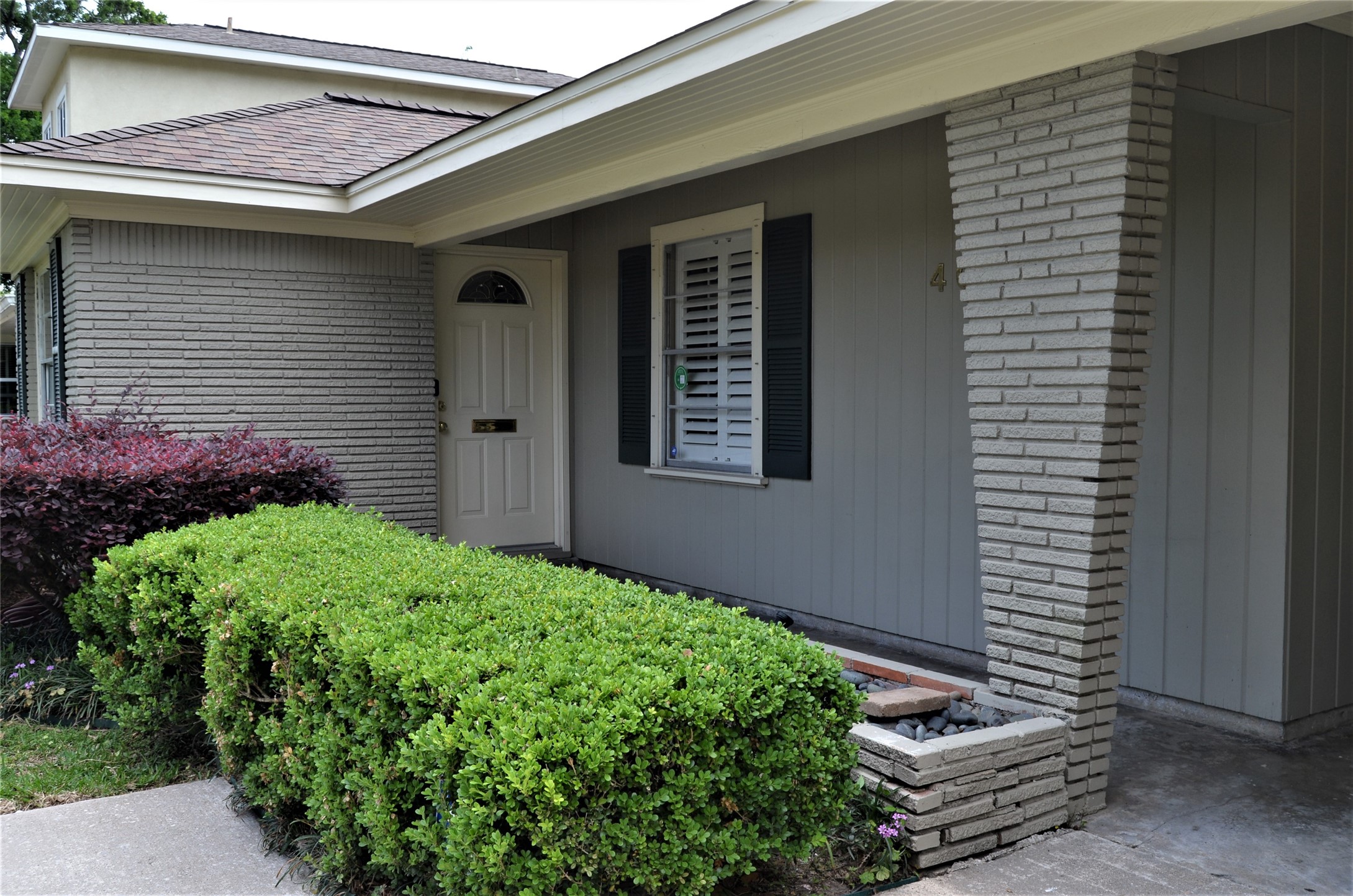 Private entrance with covered porch.