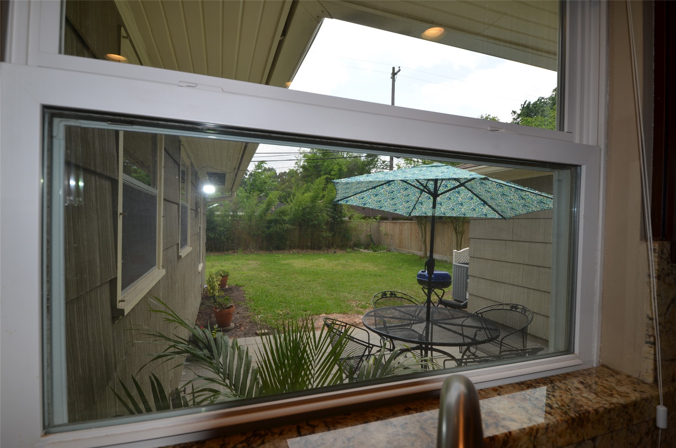 Enjoy a picturesque backyard view from the kitchen window.