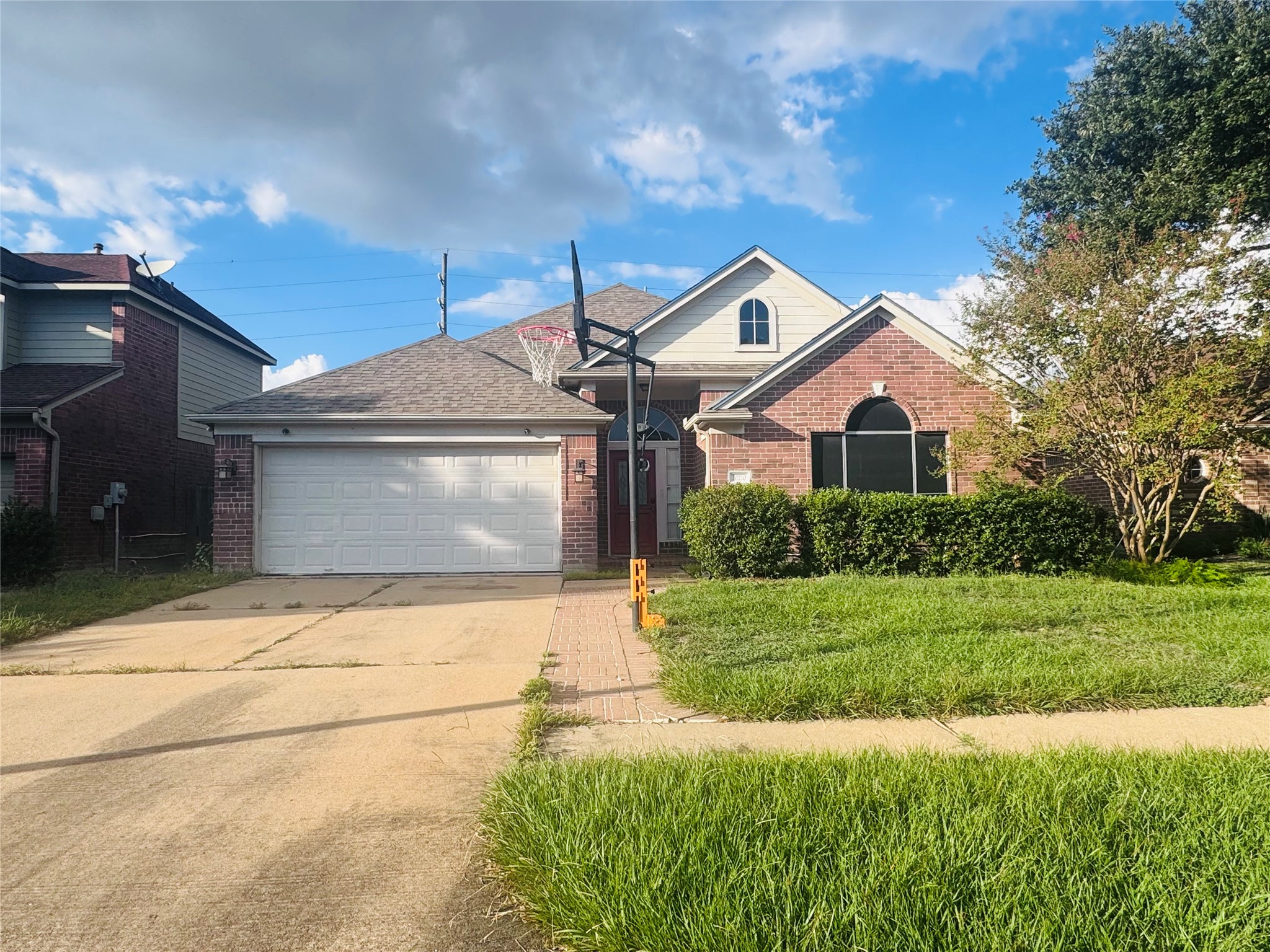 Charming brick home with a two-car garage.
