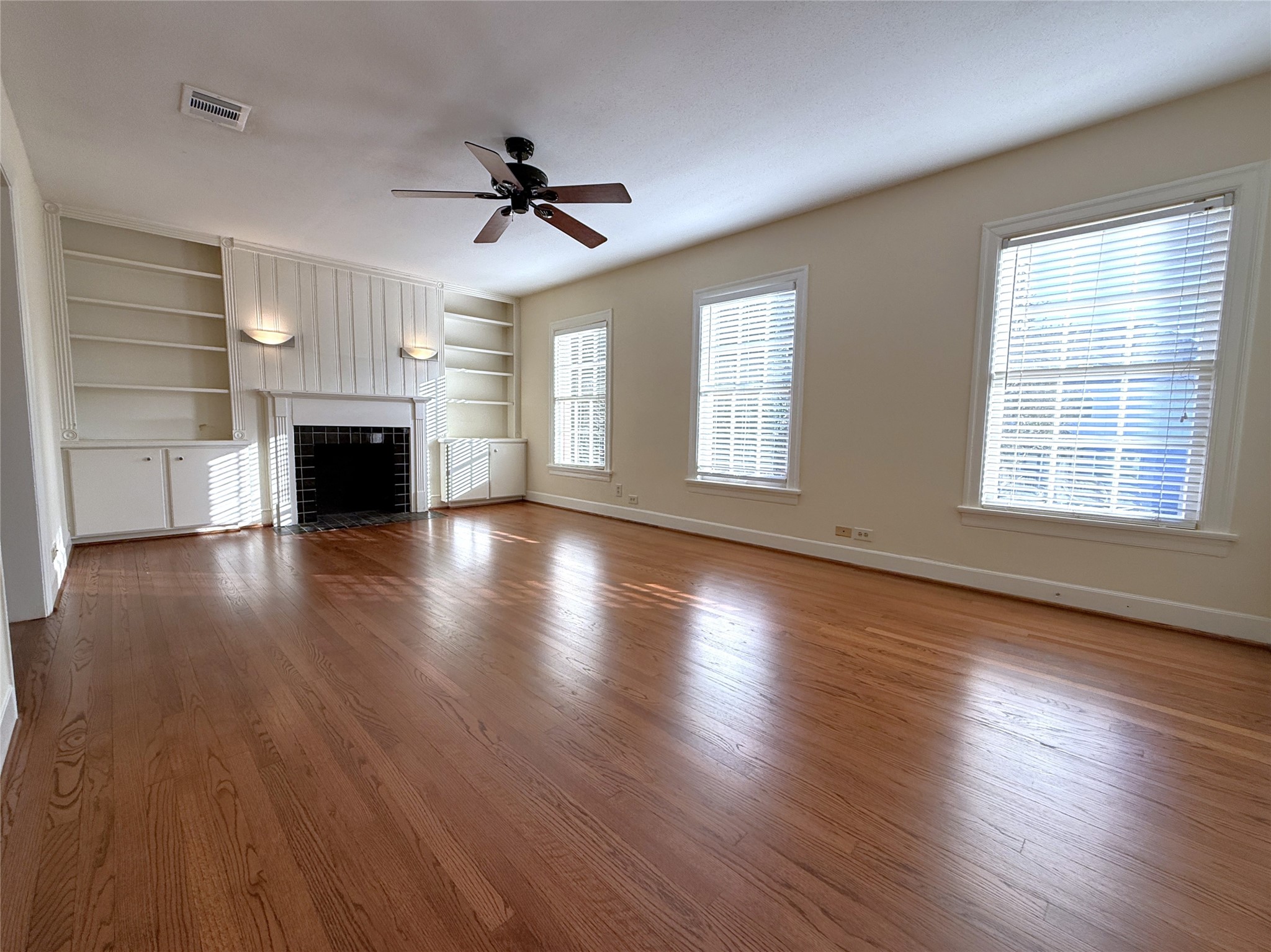 From tri windows, natural light flows into the living room. Enjoy the beautiful real hardwood flooring. From tri windows, natural light flows into the living room. Enjoy the beautiful real hardwood flooring.