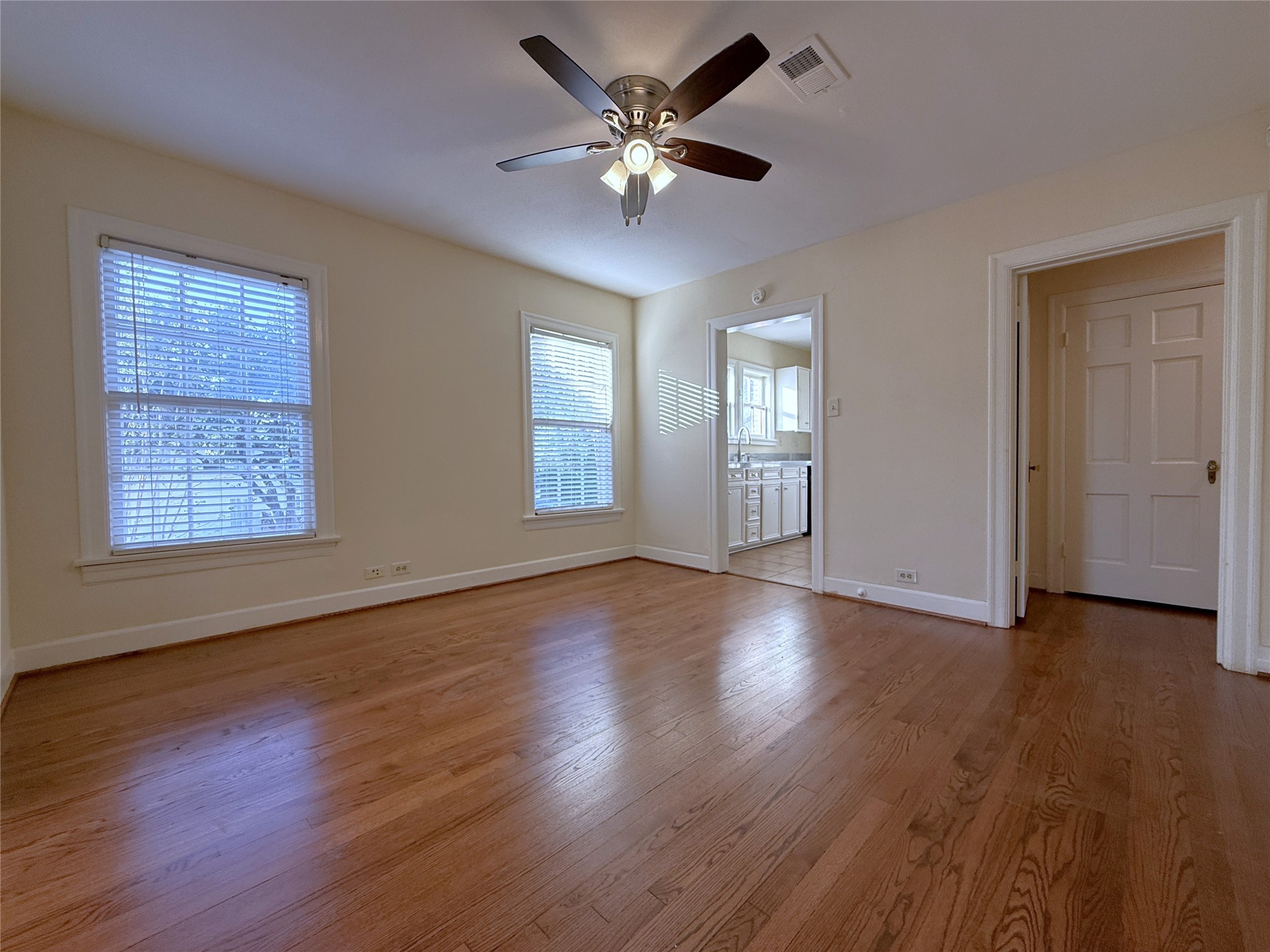 from the dining room, a privacy door opens into the hallway leading to the bedrooms & baths.
