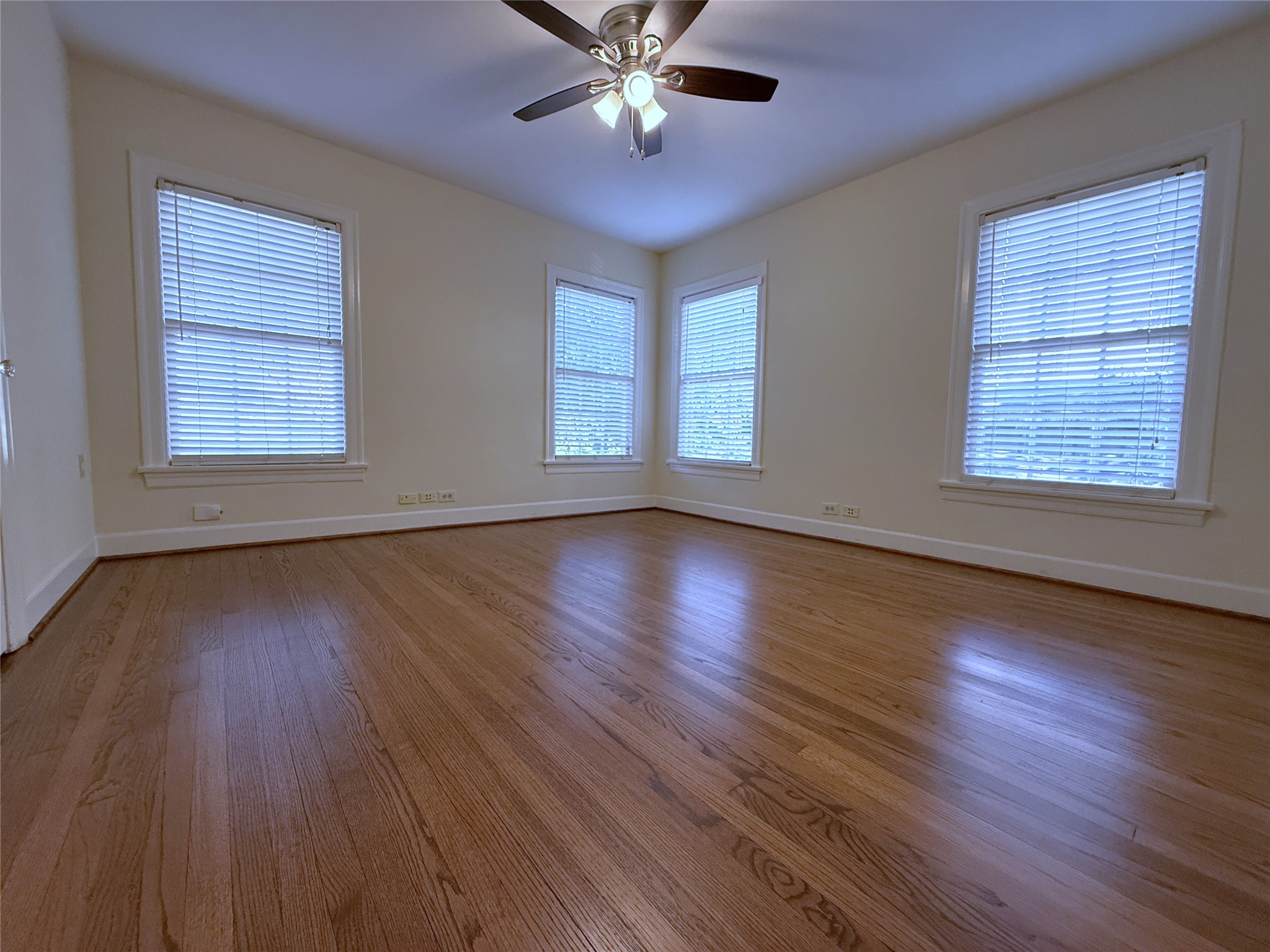 The back bedroom with ceiling fan.