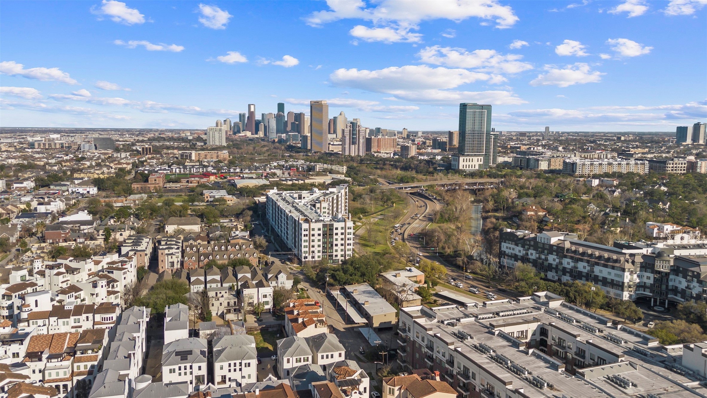 Aerial perspective highlighting the home's proximity to Memorial Park, Buffalo Bayou, and surrounding Houston amenities.